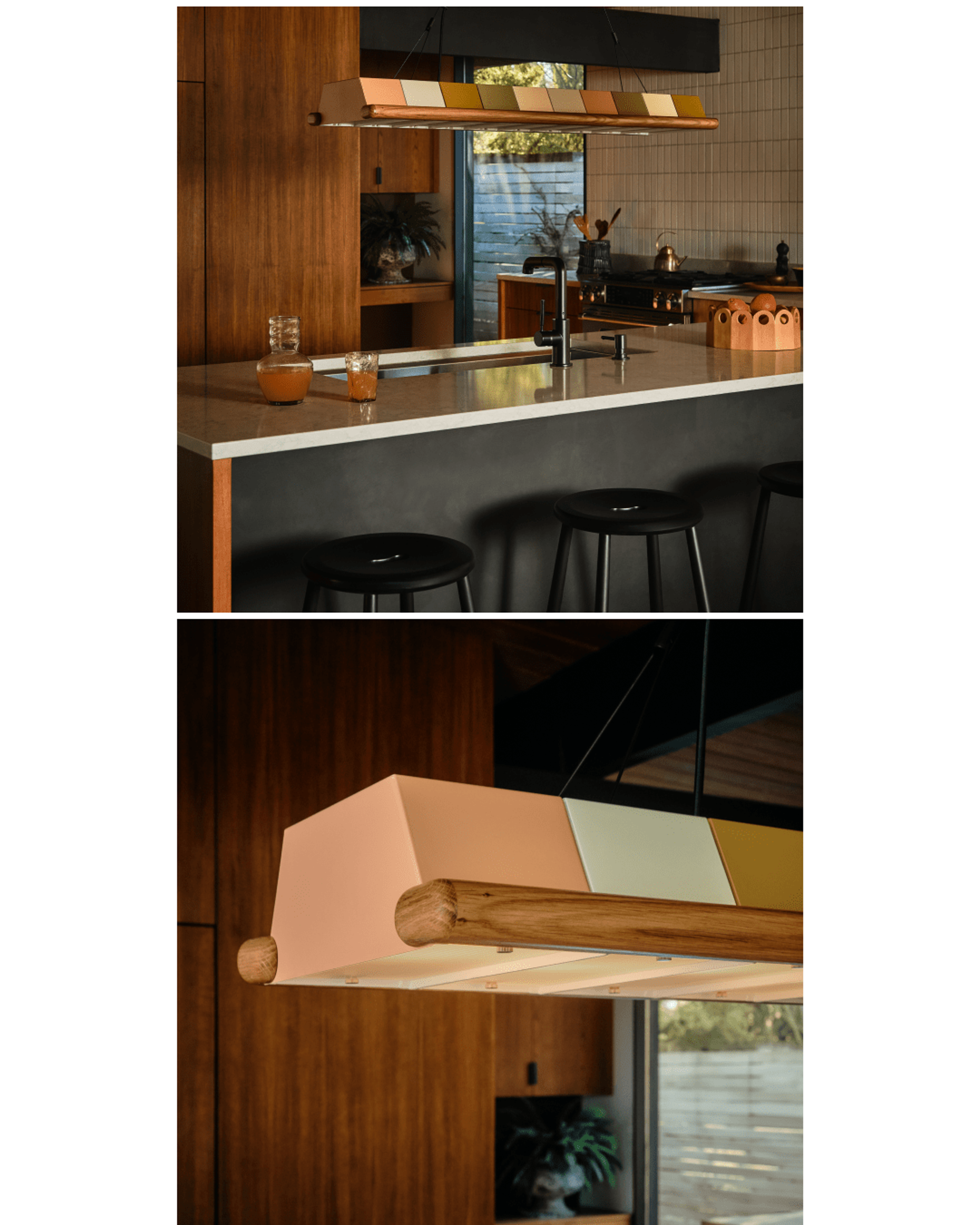 Low-lit kitchen island with metal multi-colored chandelier over deep metal sink