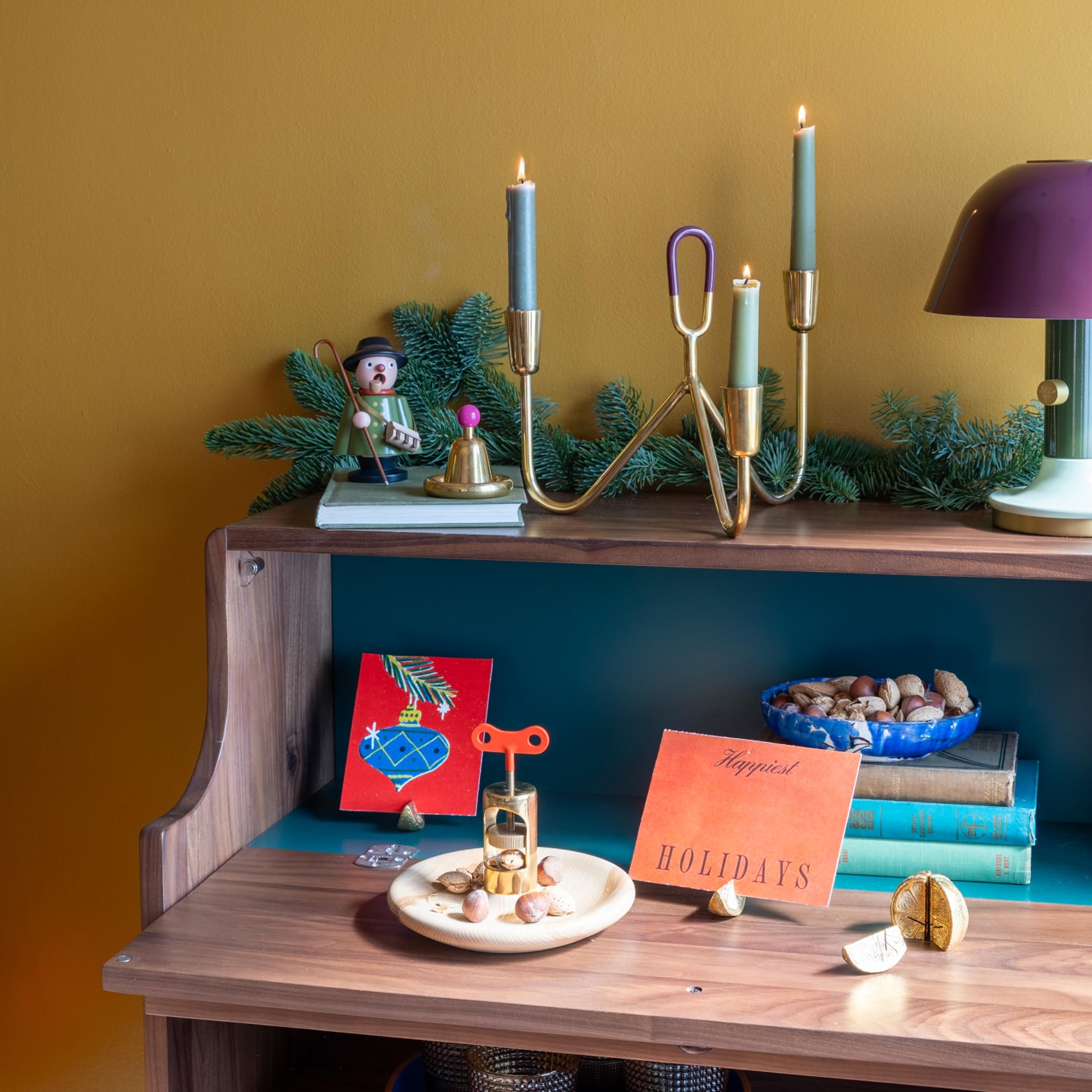 Holiday decor and greenery on a cabinet