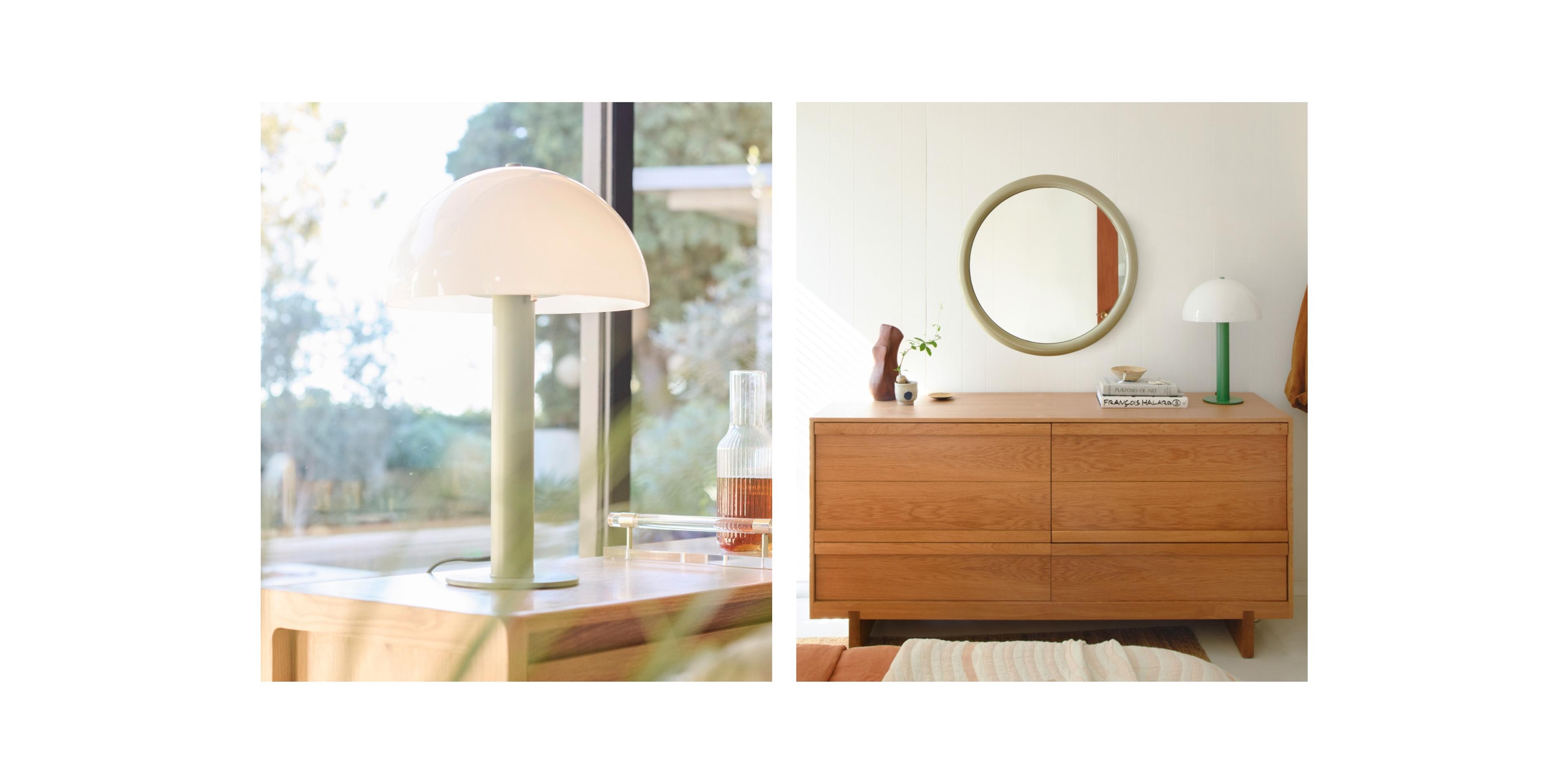 Mushroom shaped lamp on side table with sage green body and opal glass dome shade