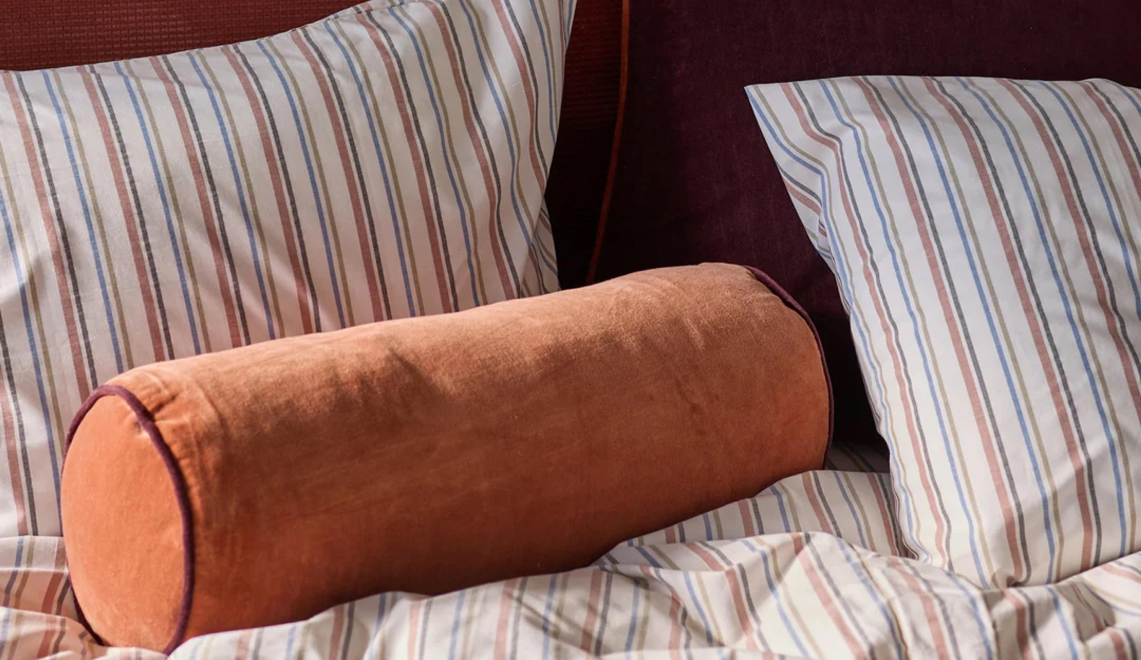 Up close shot of a cozy bed.
