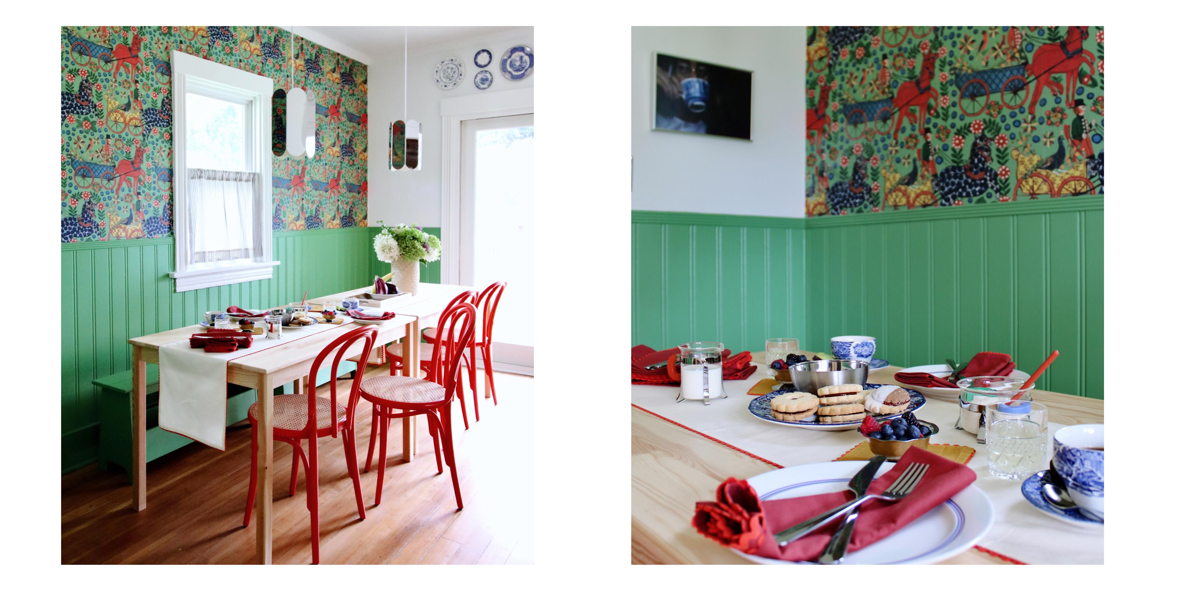 green paneled dining room with maple table and red scalloped napkins