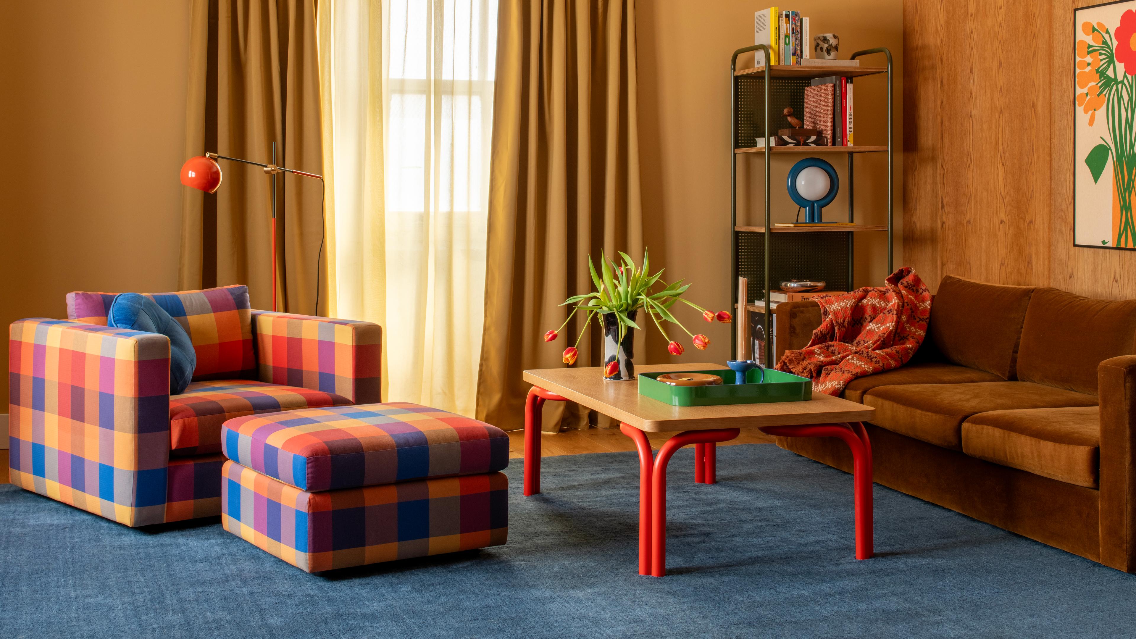 Plaid couch in modern wood-paneled room