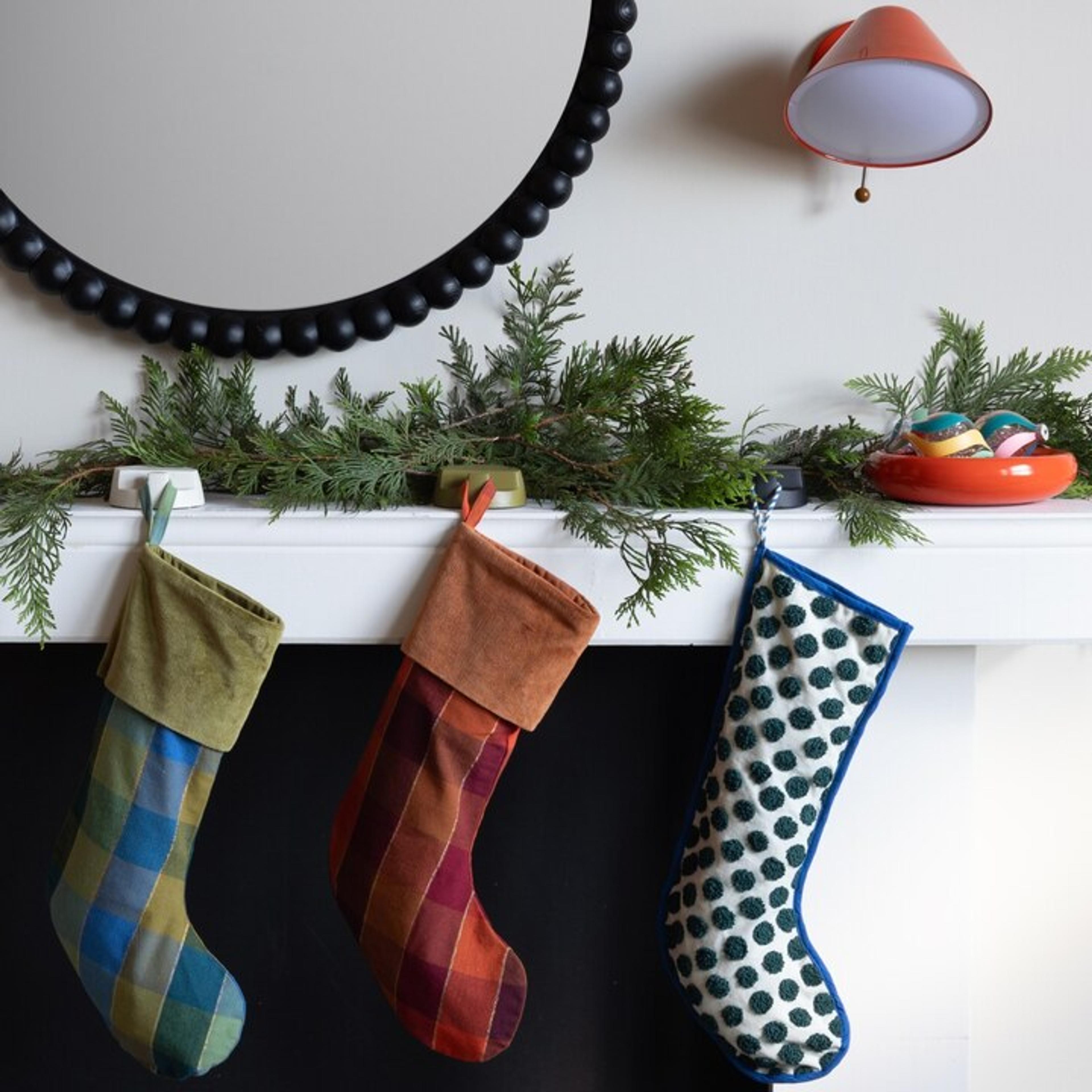 Fireplace decorated for the holiday with stockings