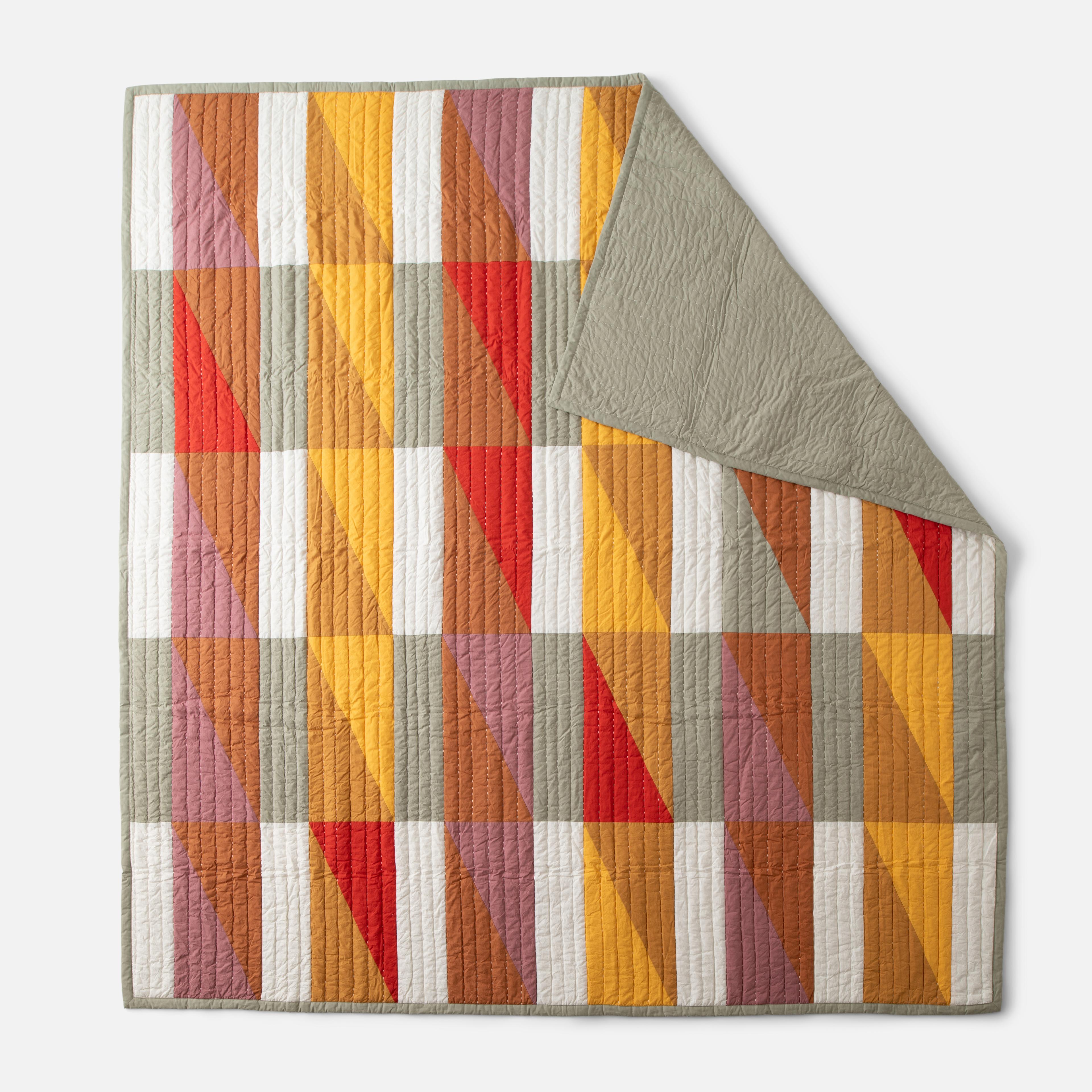 Folded quilt showing front and back