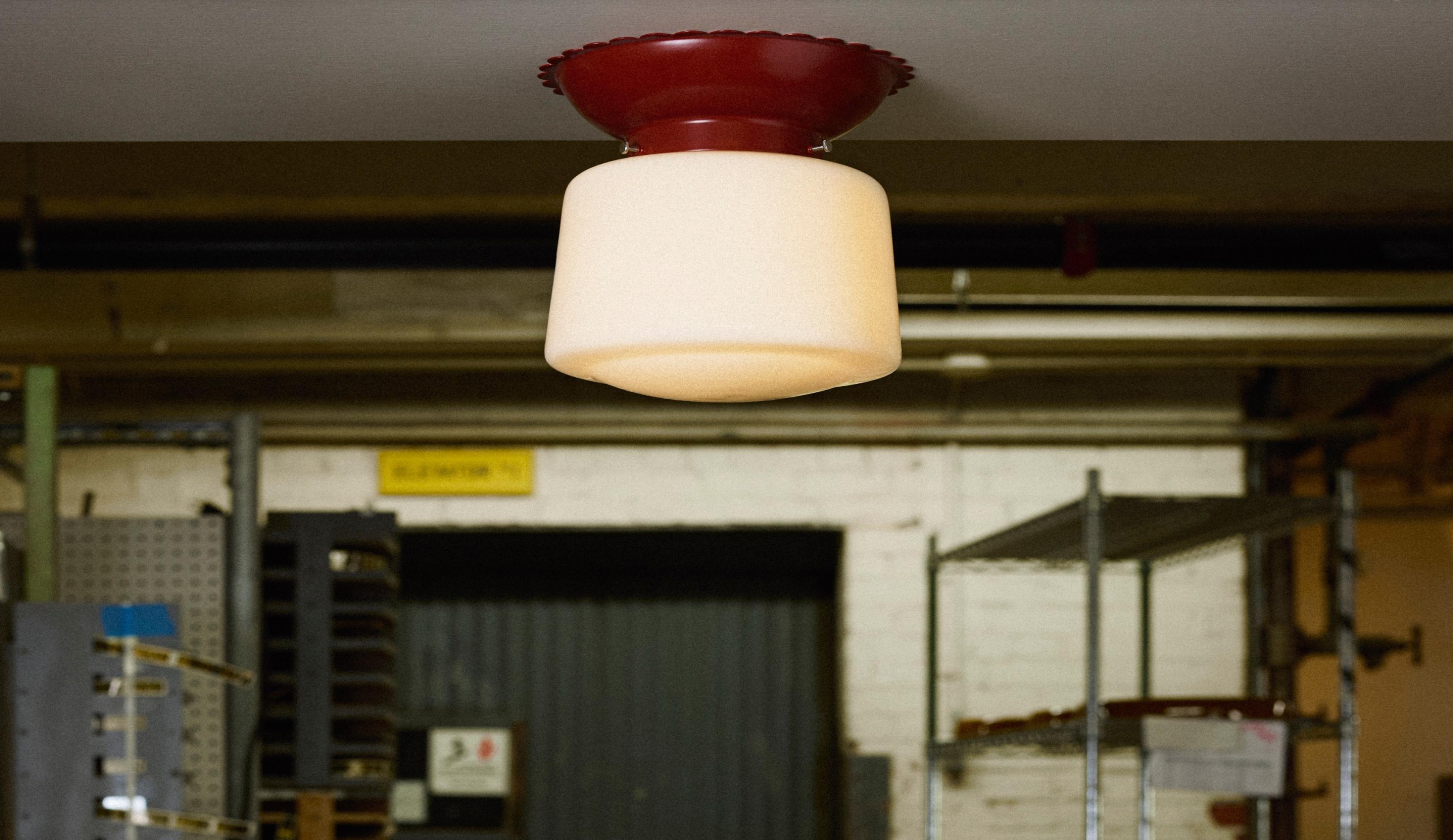 Paprika colored flush mount with scalloped edges and drum shade 