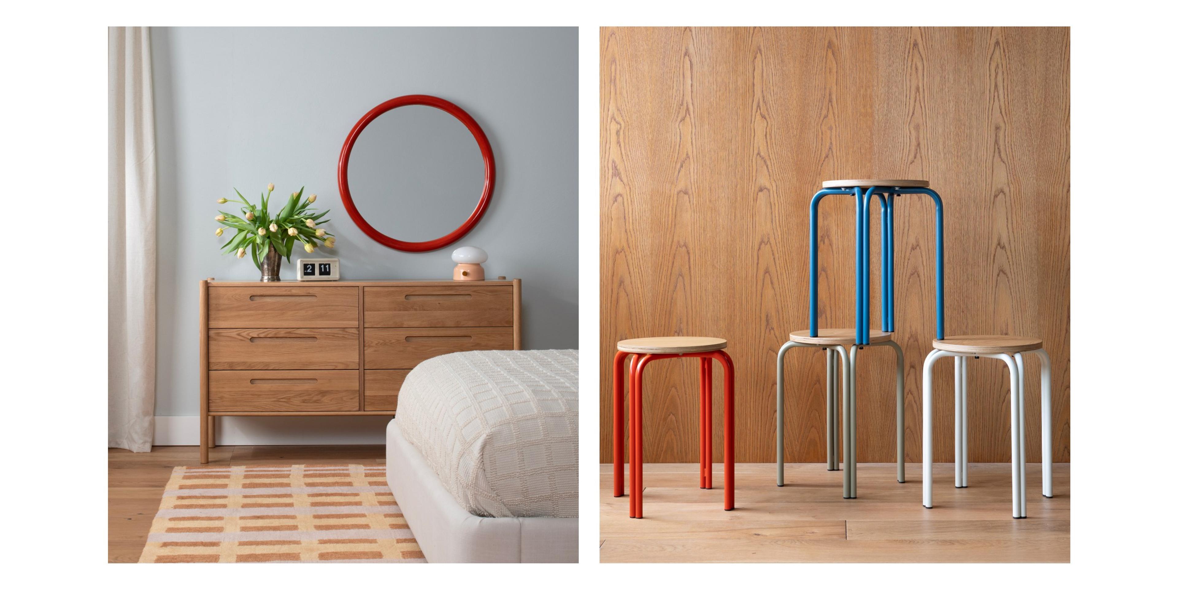 bedroom set up with red round mirror and stack of stools