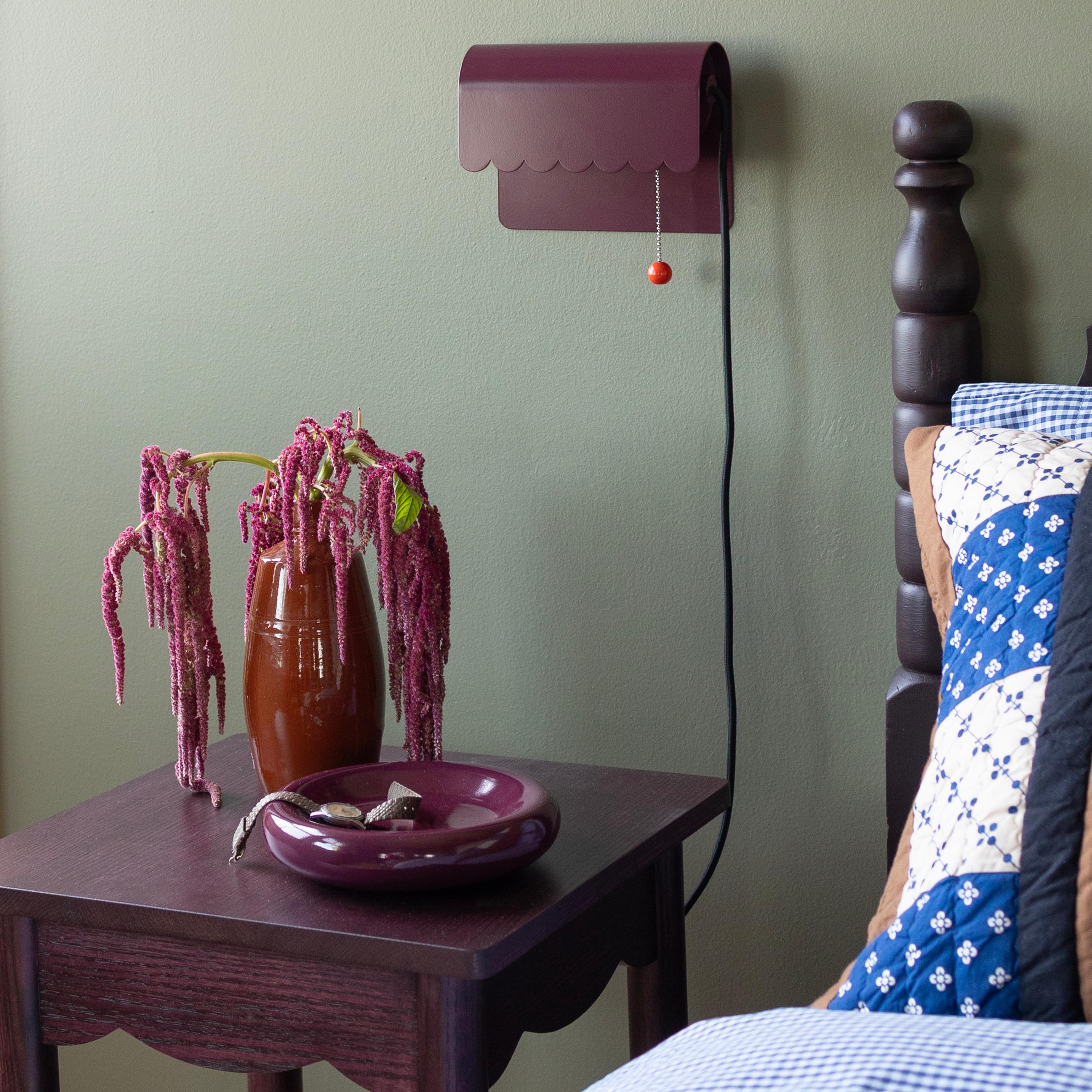 Green wall with purple accents.