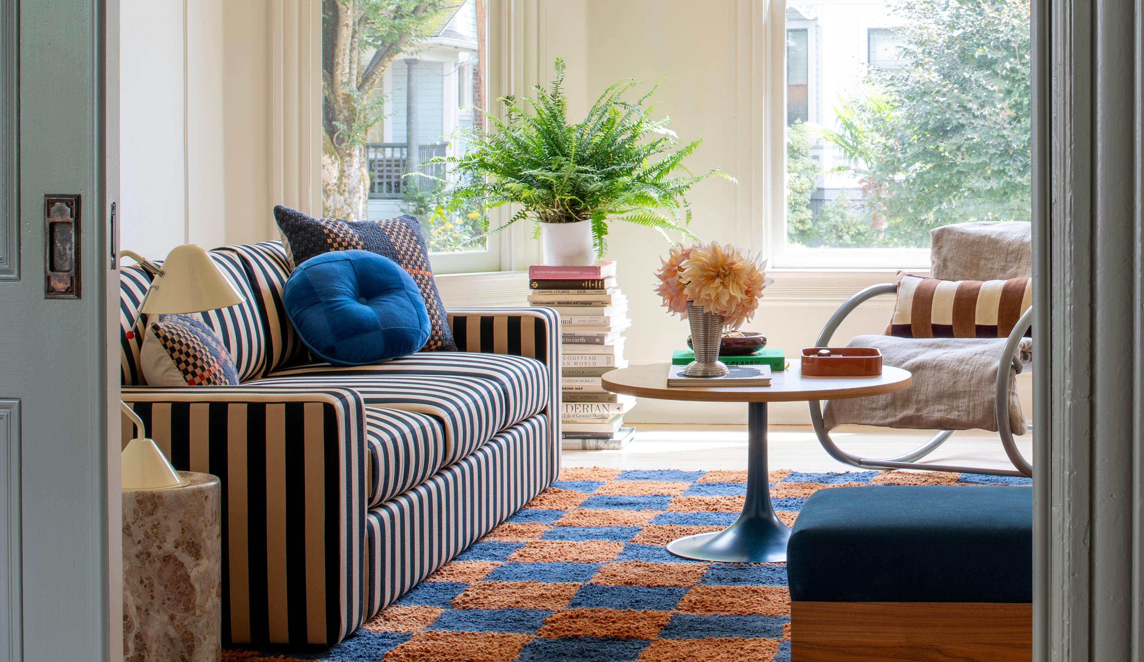 Layered living room with striped couch
