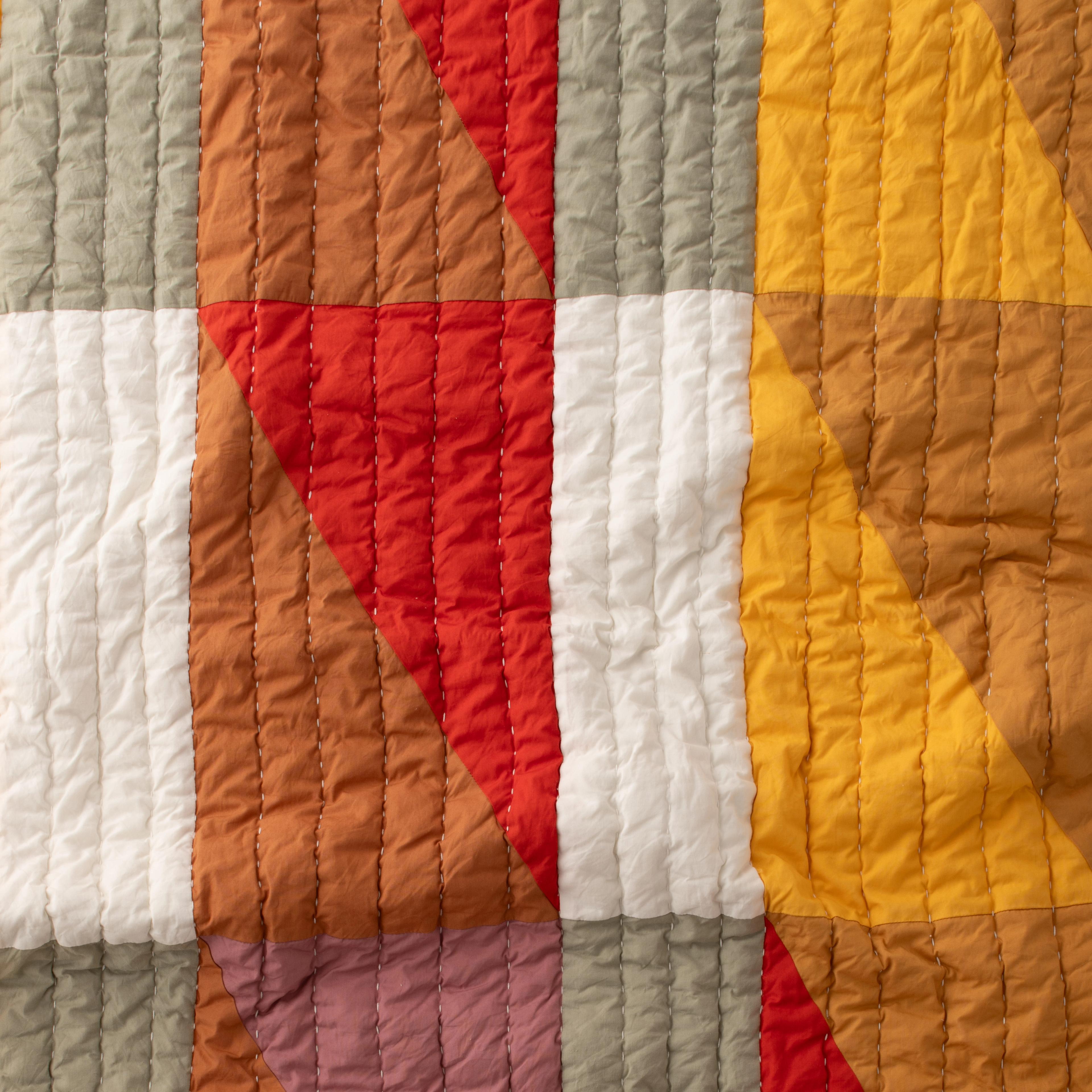 close up of quilt colors and stitching
