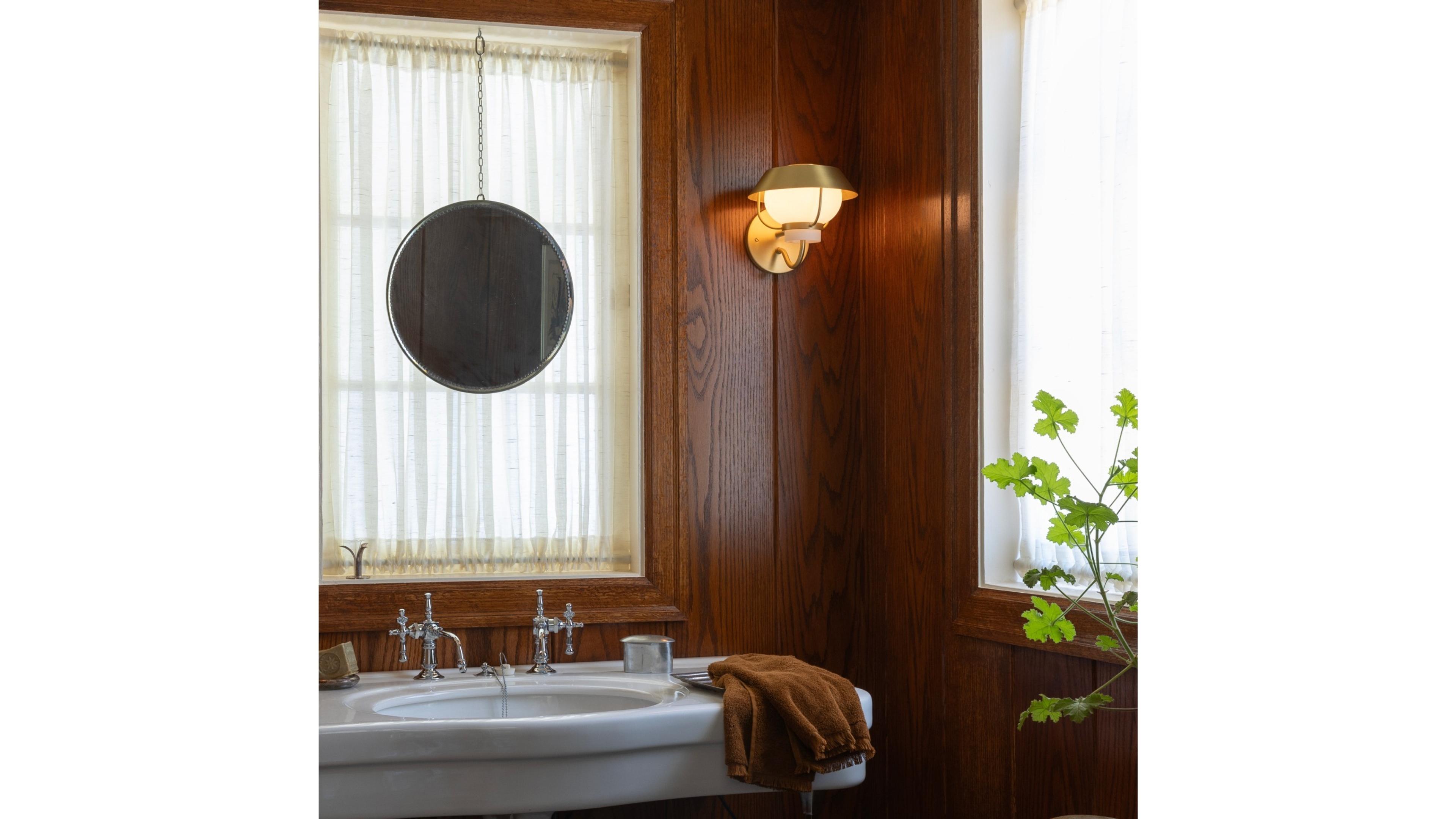 Cozy wood-paneled bathroom.