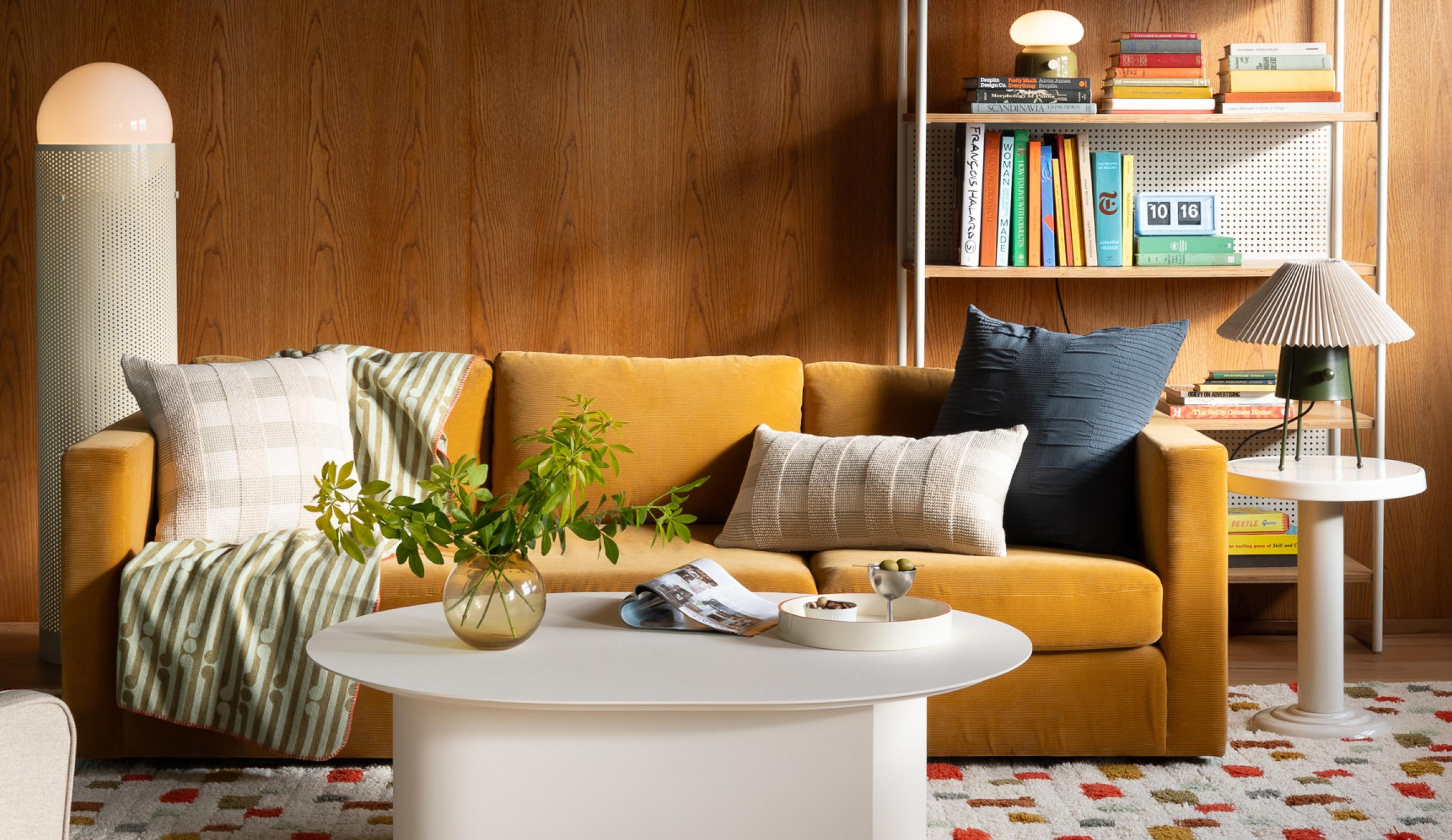 studio living room with white coffee table and white shelf behind