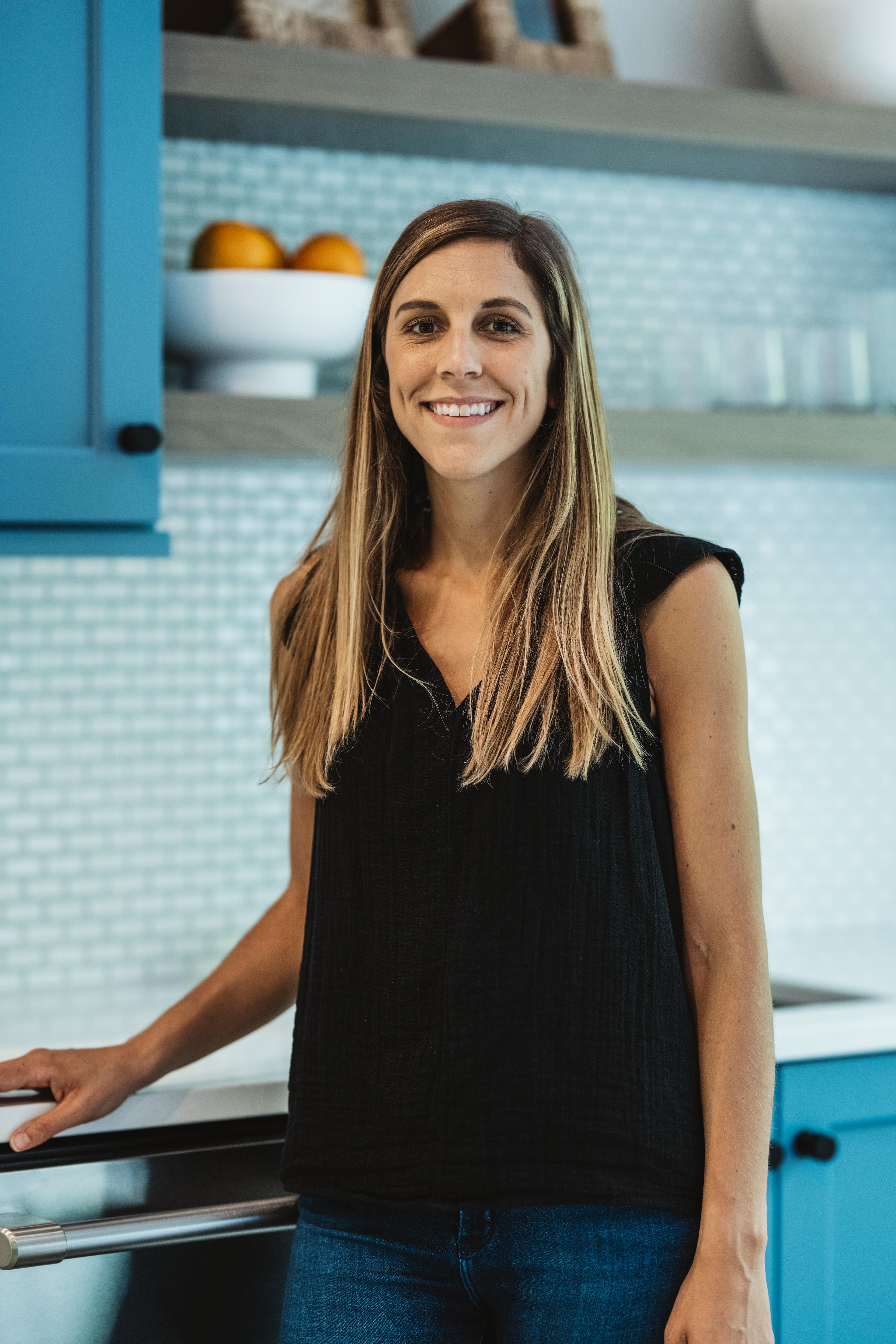 Woman posing and smiling.