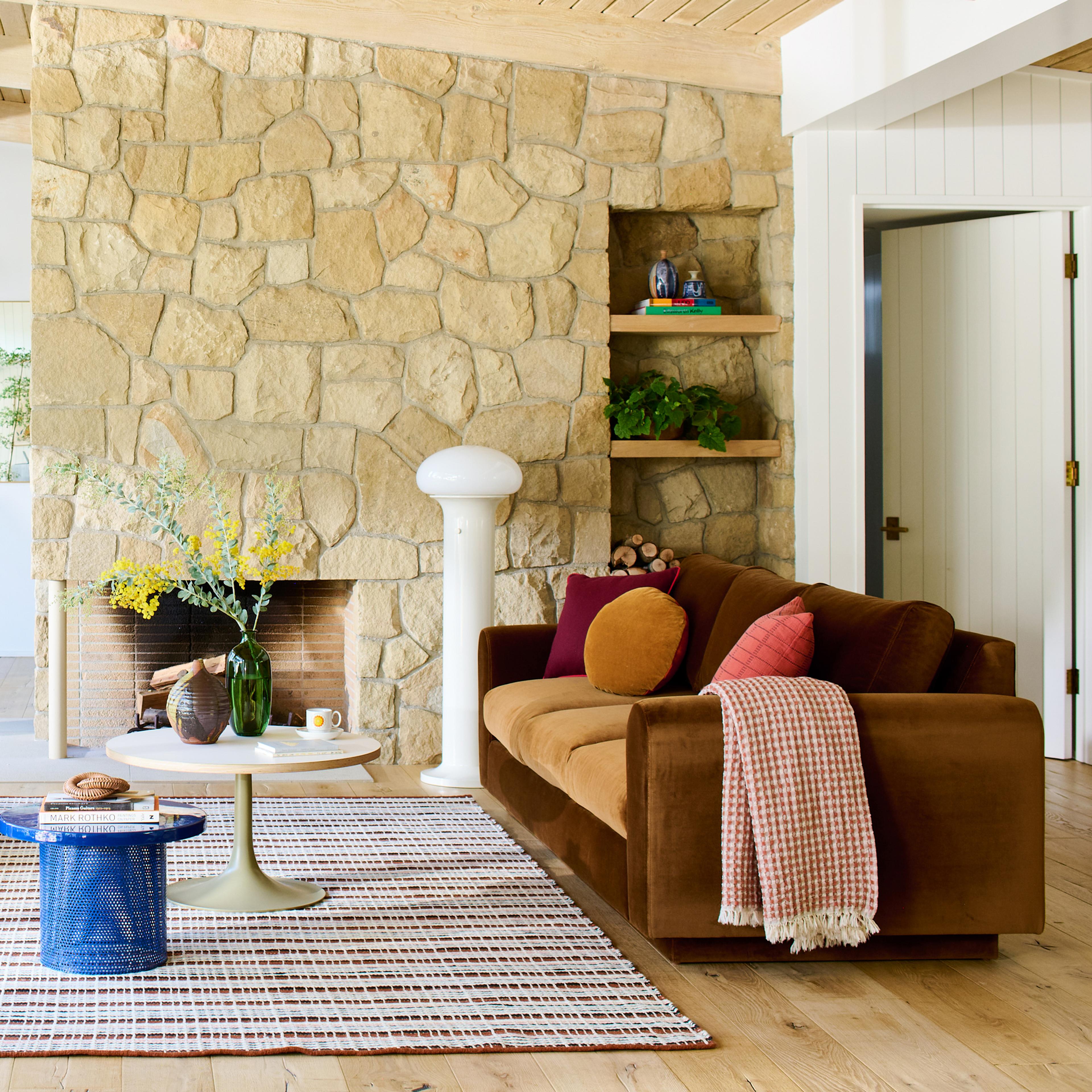 Living room with colorful accents and mushroom shaped floor lamp