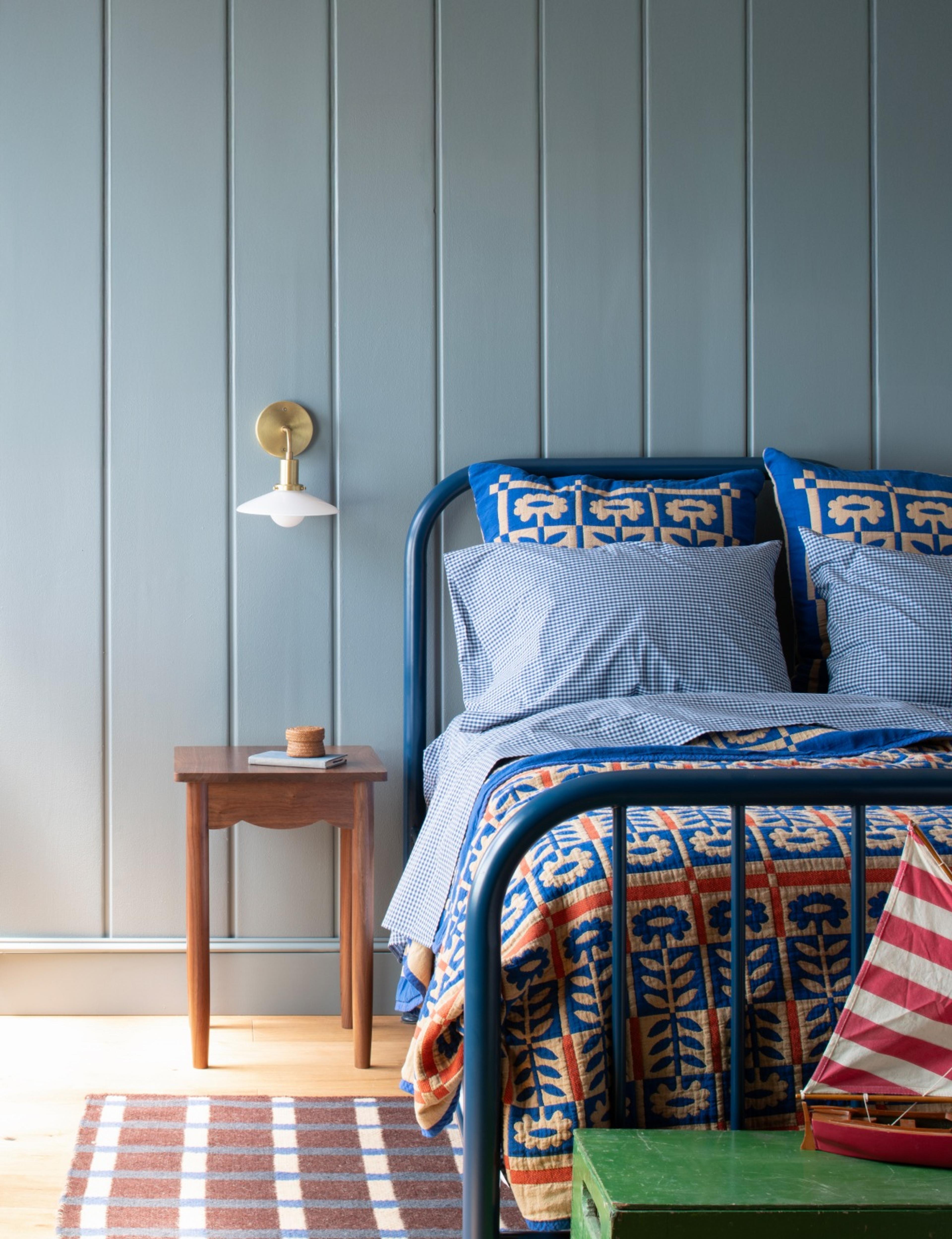 bed with cobalt Stillwater quilt