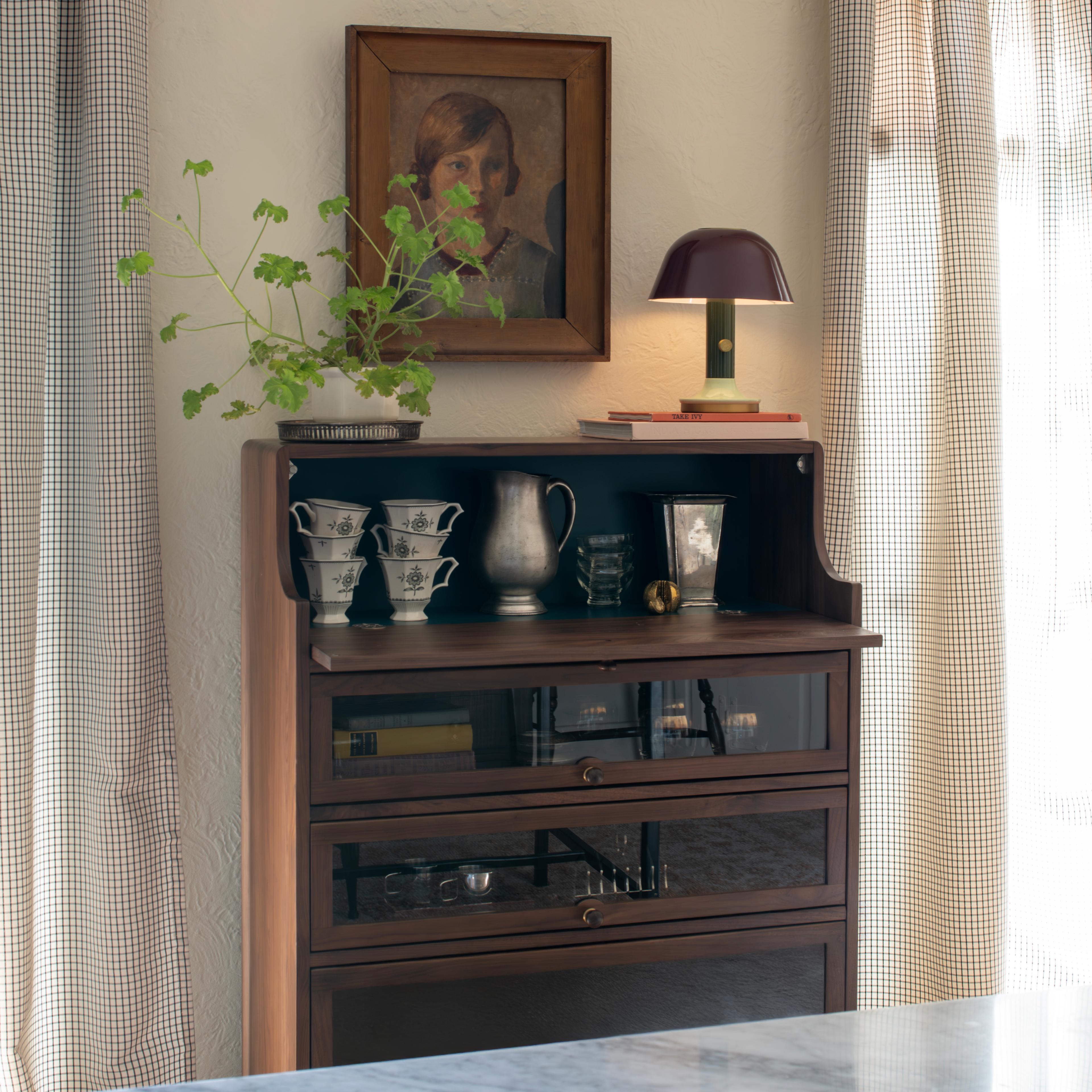 Barrister cabinet filed with vintage objects.