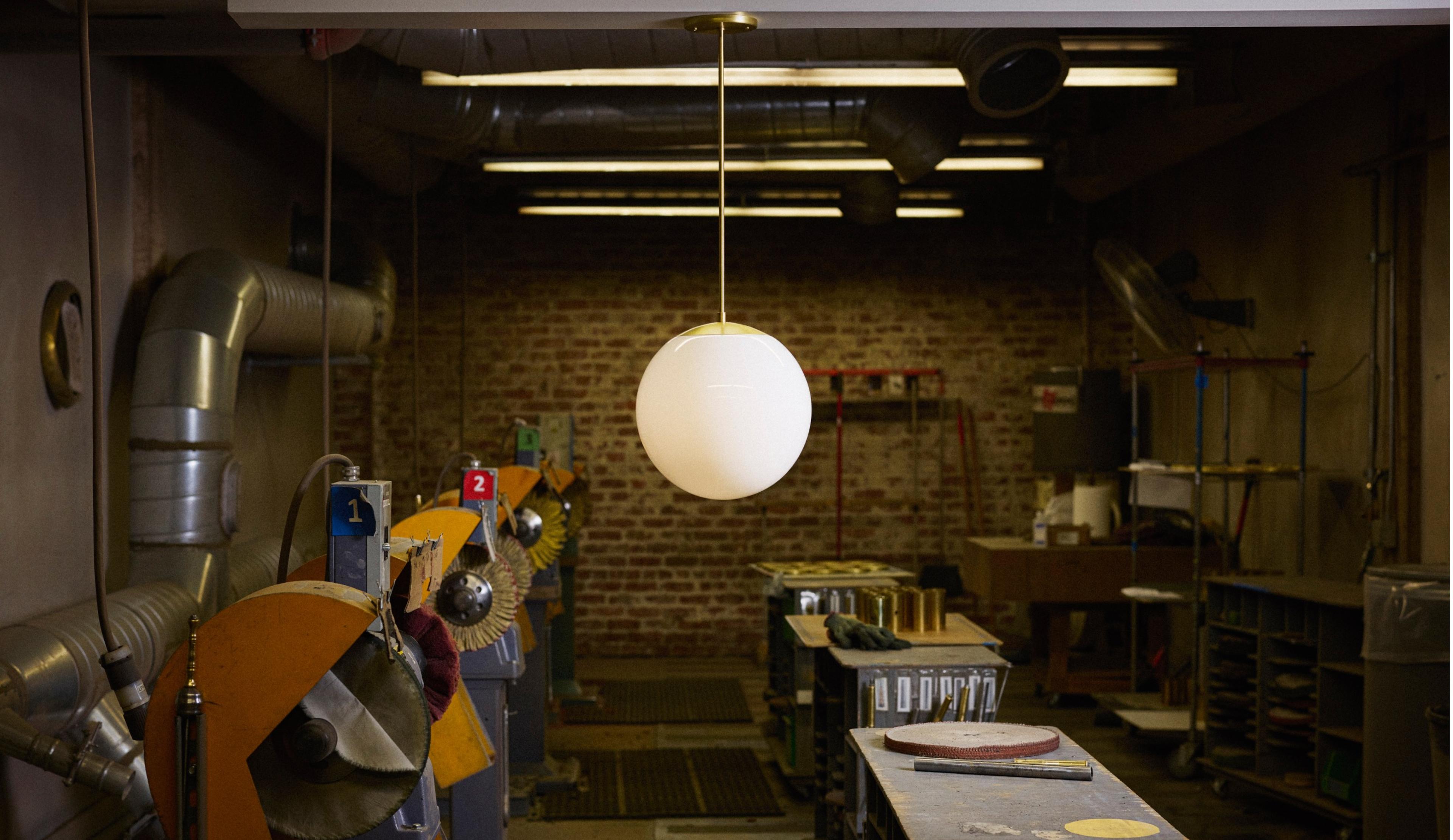 Natural brass rod pendant with opal glass globe shade hanging i