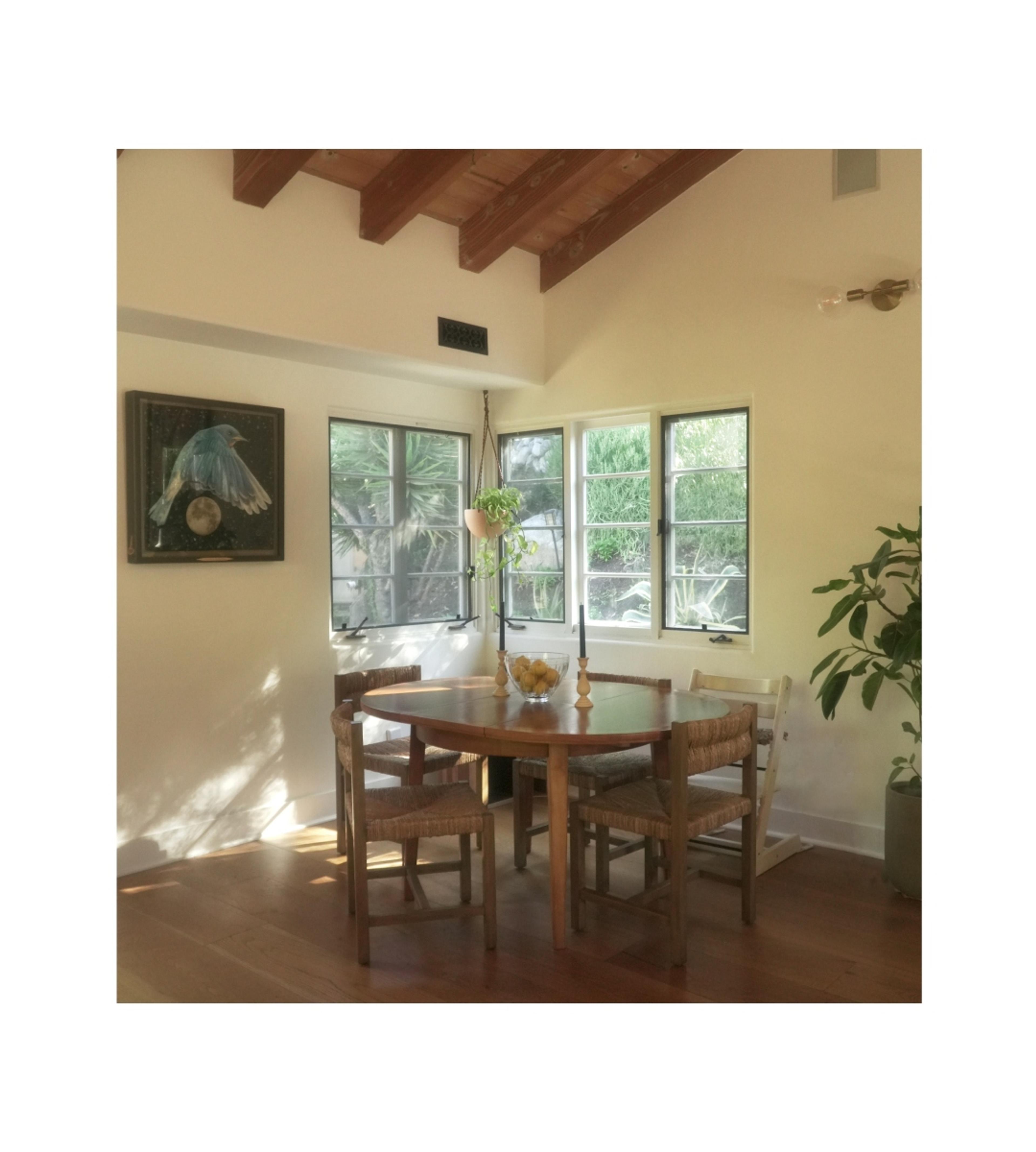 dining nook with wooden table and chairs 