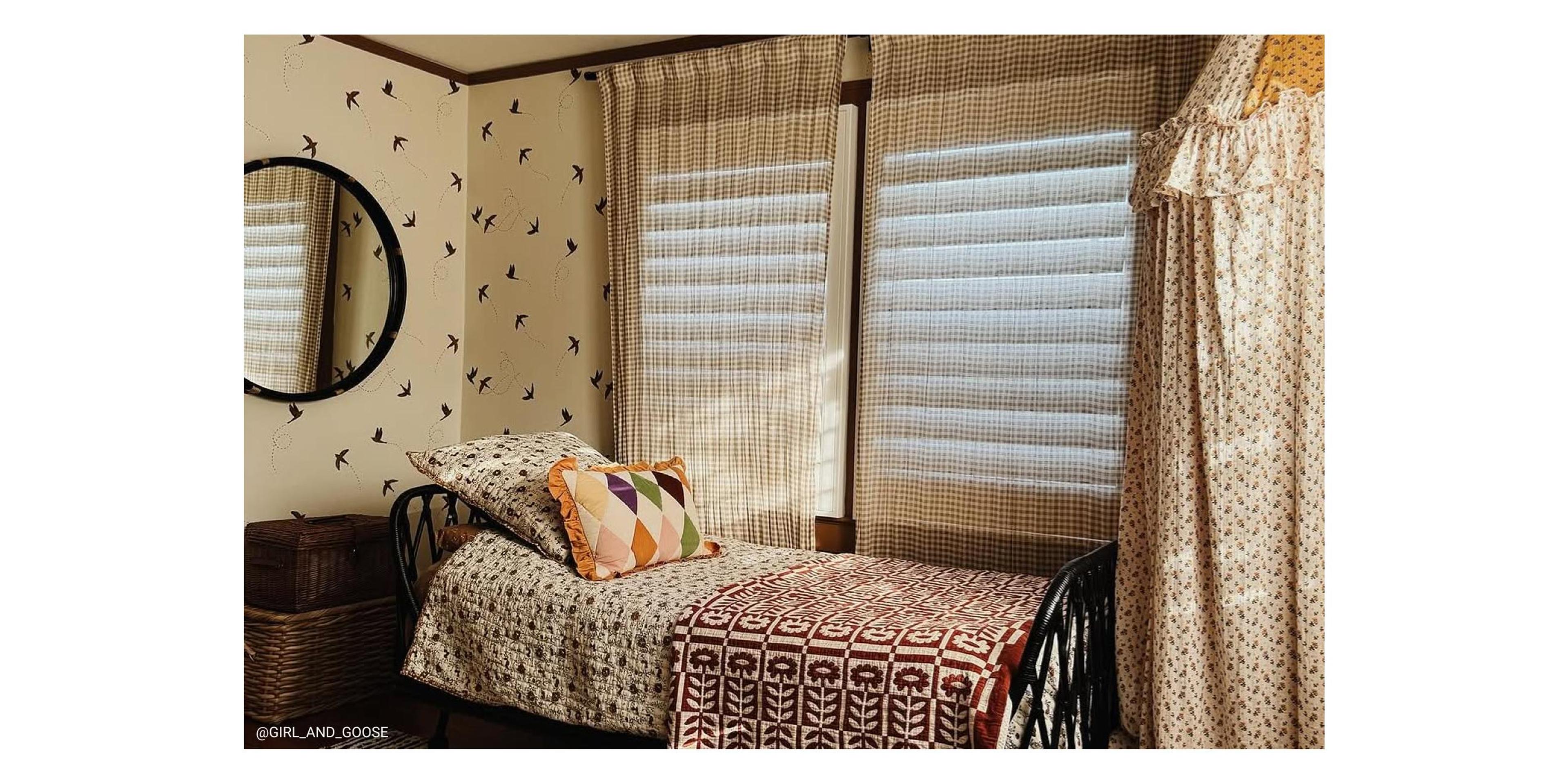 Eclectic bed with floral quilt. 