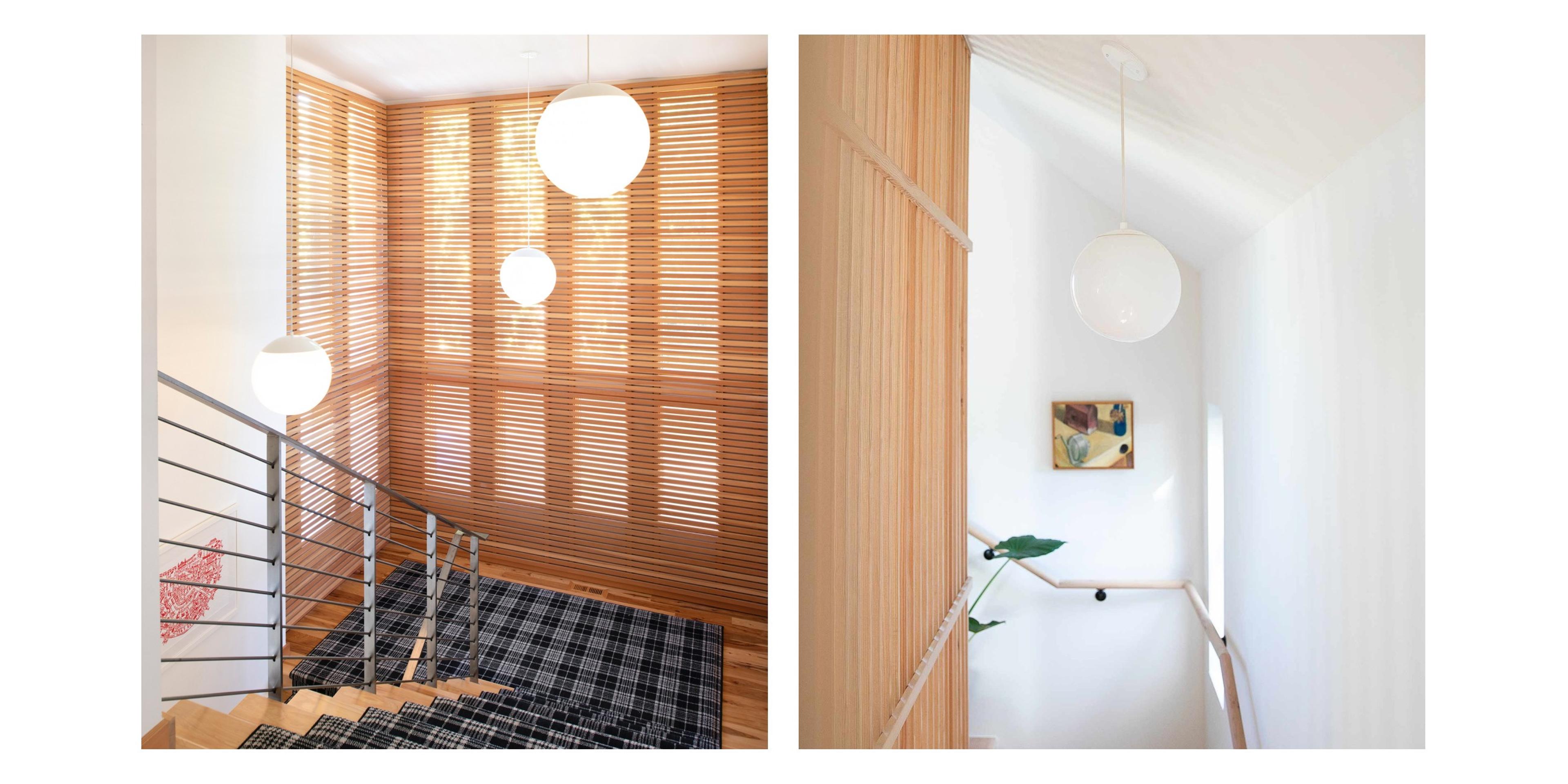 White pendant lights with globe shades in stairway 