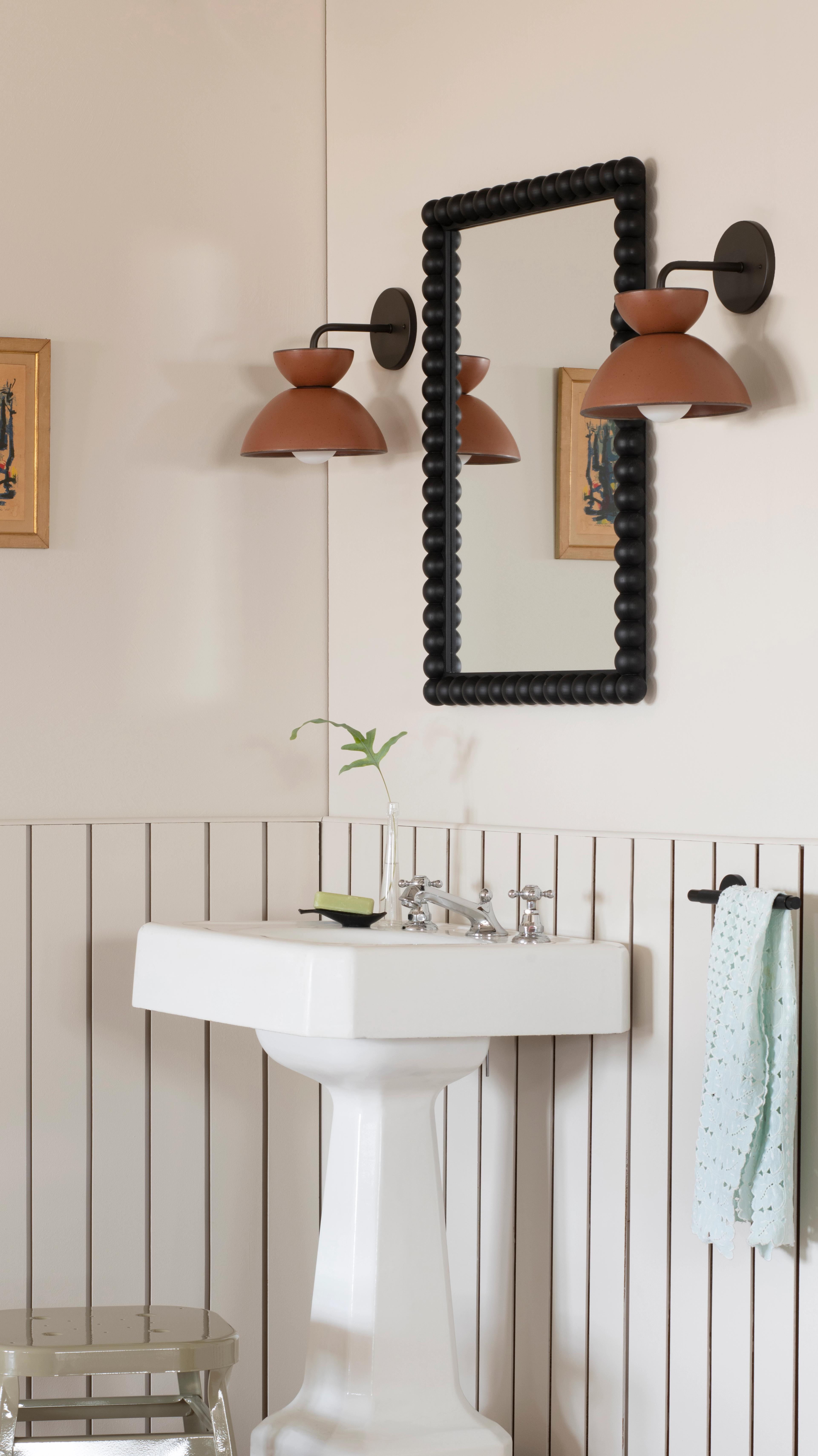 Sconce in bathroom.