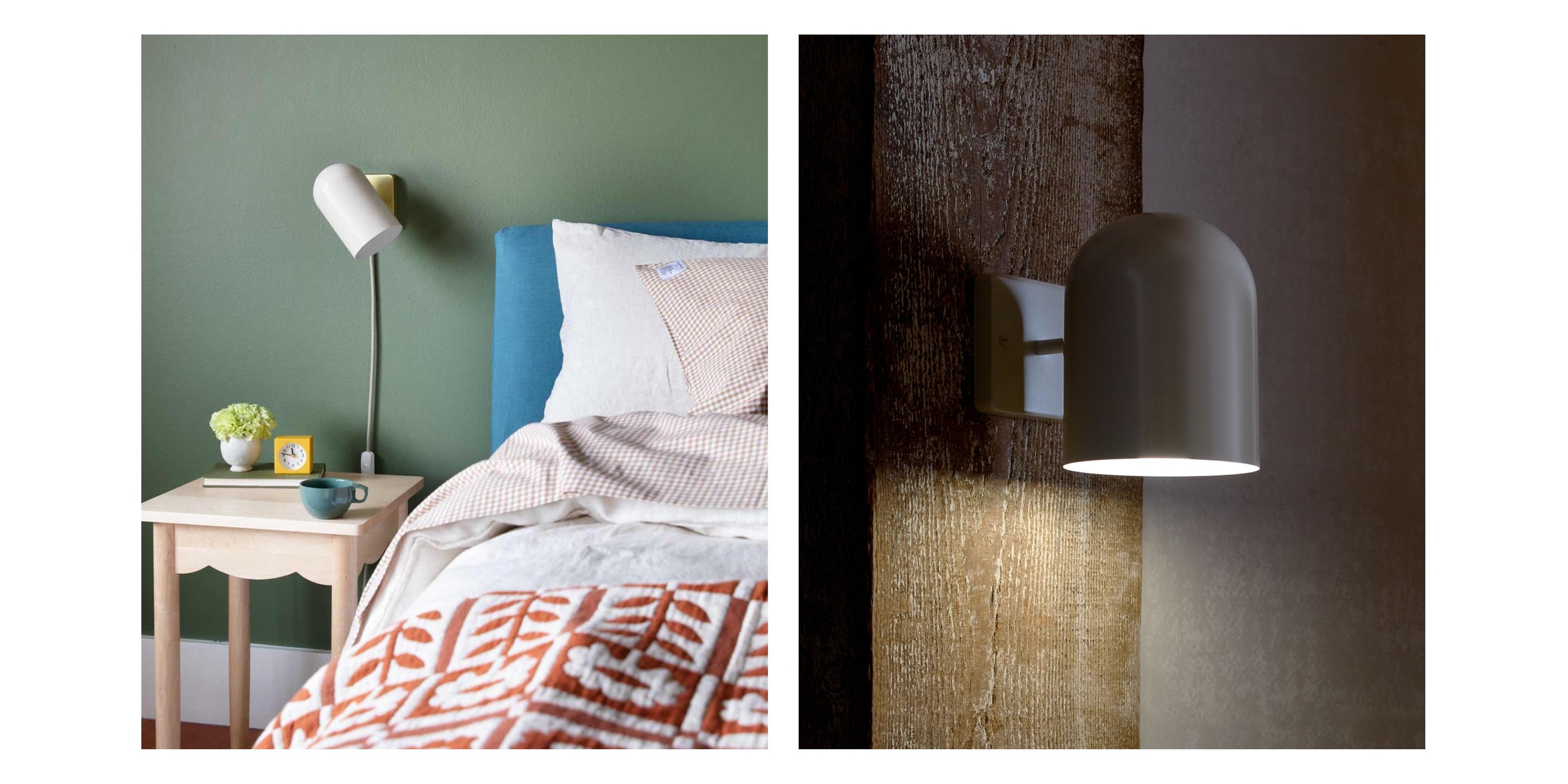 White sconce on green wall above bed for reading light 