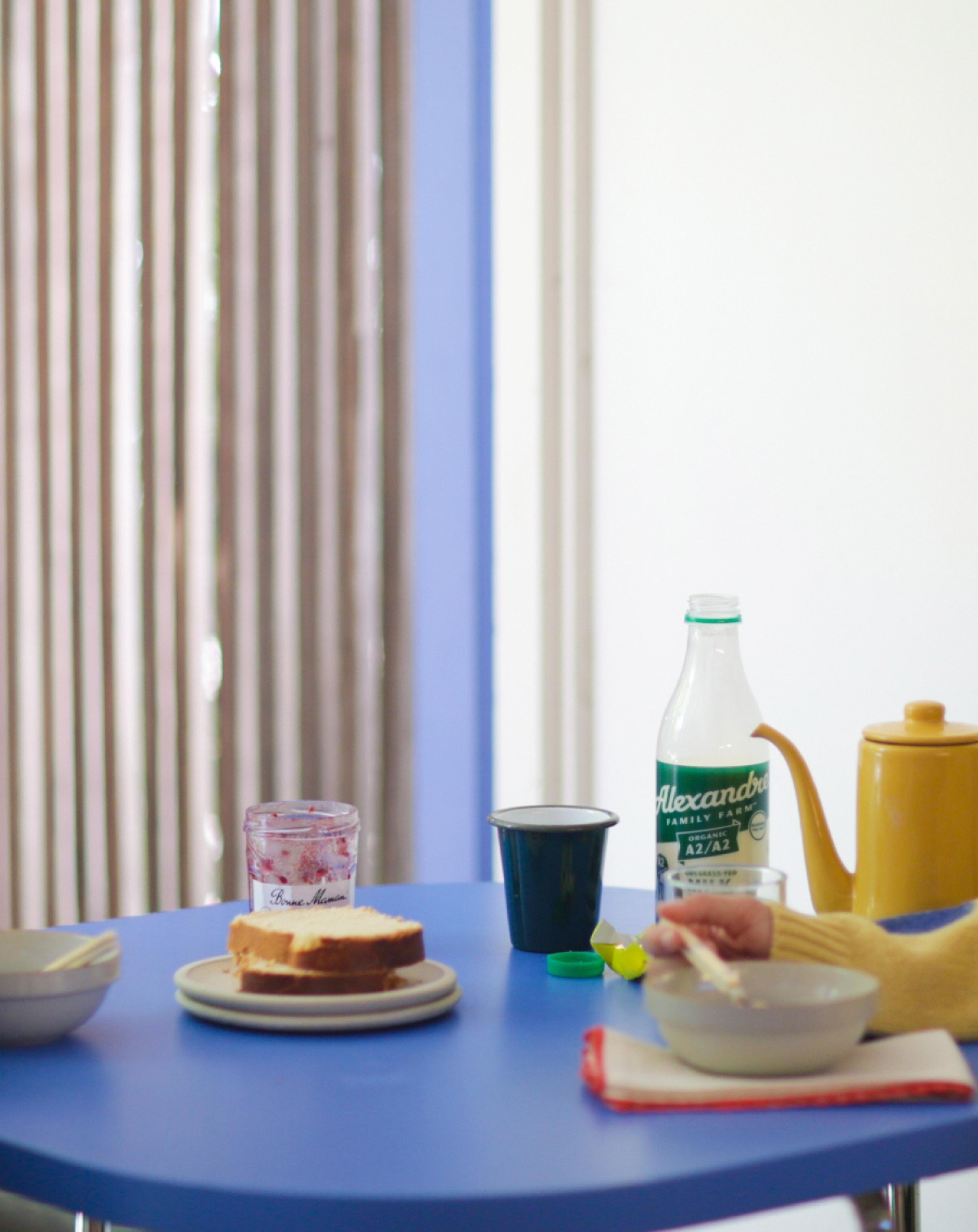 Table set for breakfast in a bright room