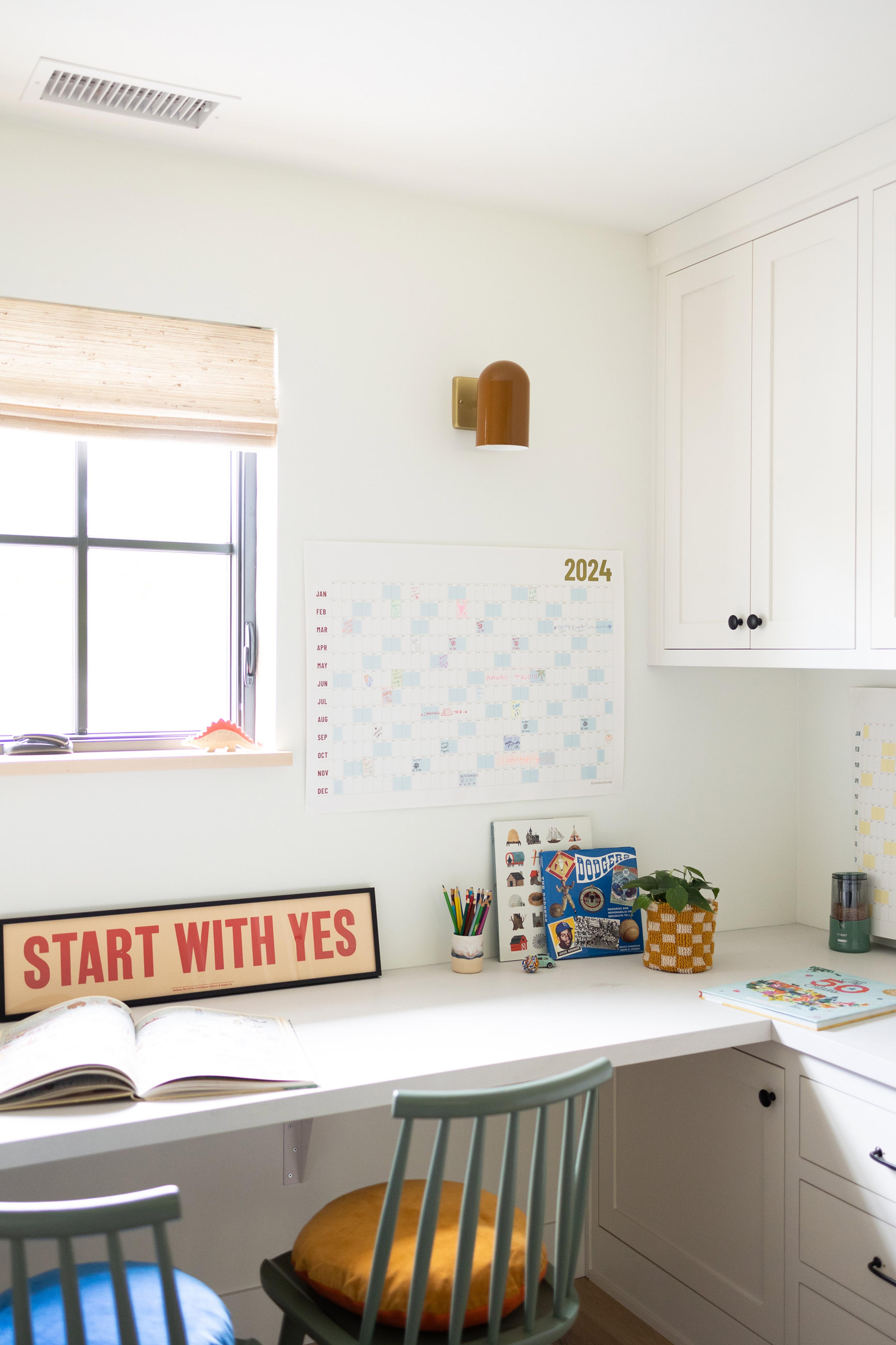 desk nook with wall calendar and cylinder butterscotch task sconce 