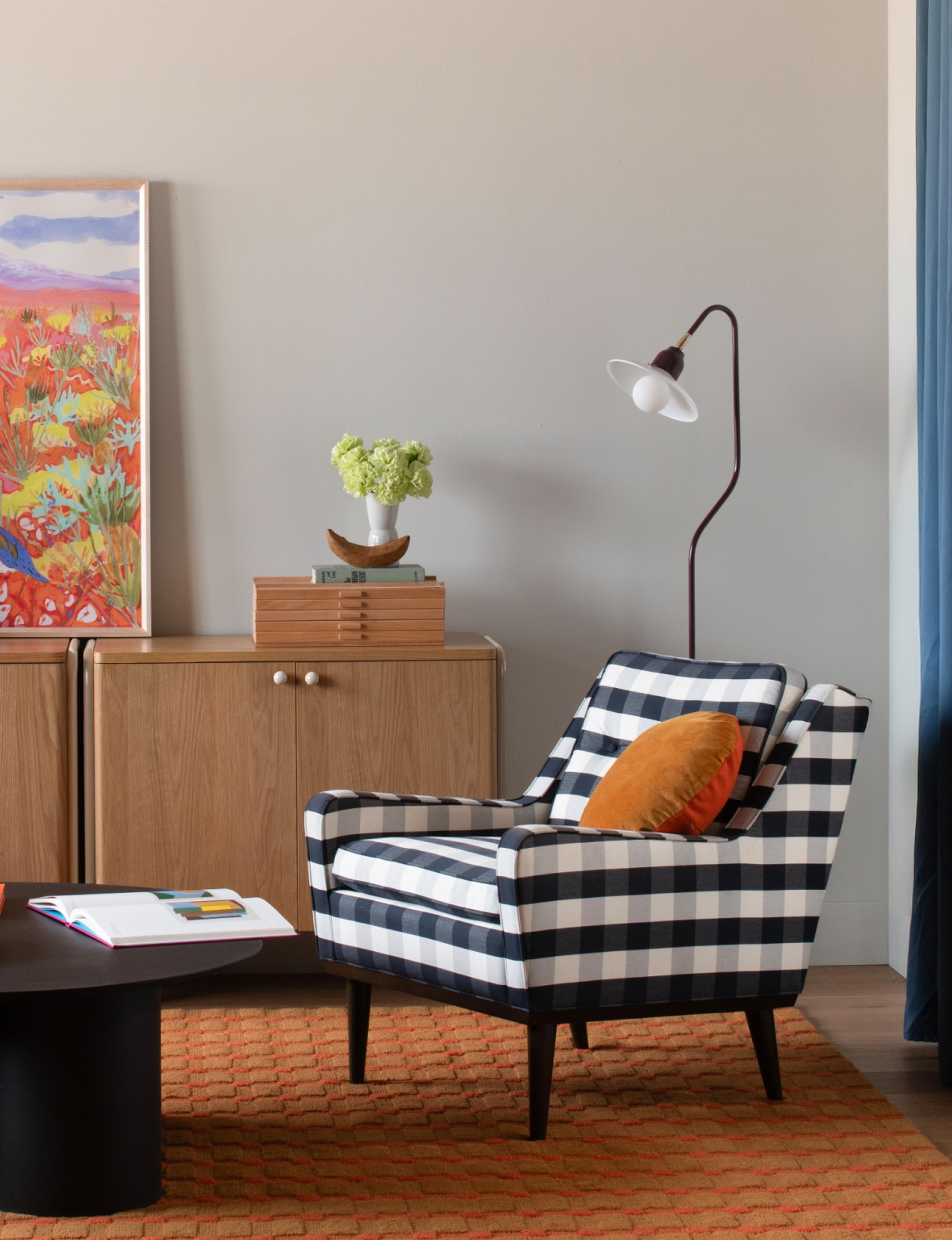 Colorful living room with black and white plaid chair