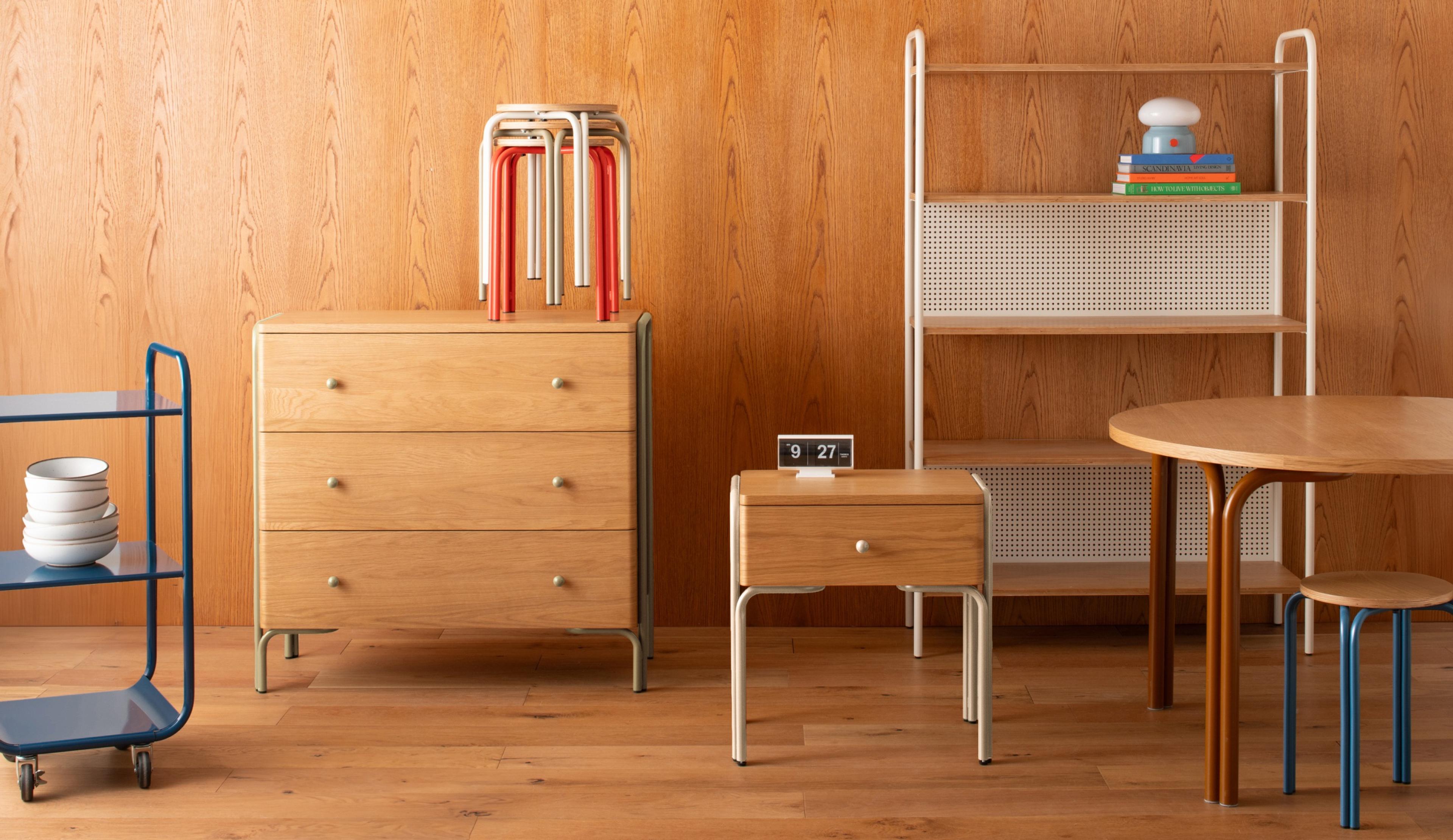 studio set up with tables, cabinets, and nightstand with colorful legs
