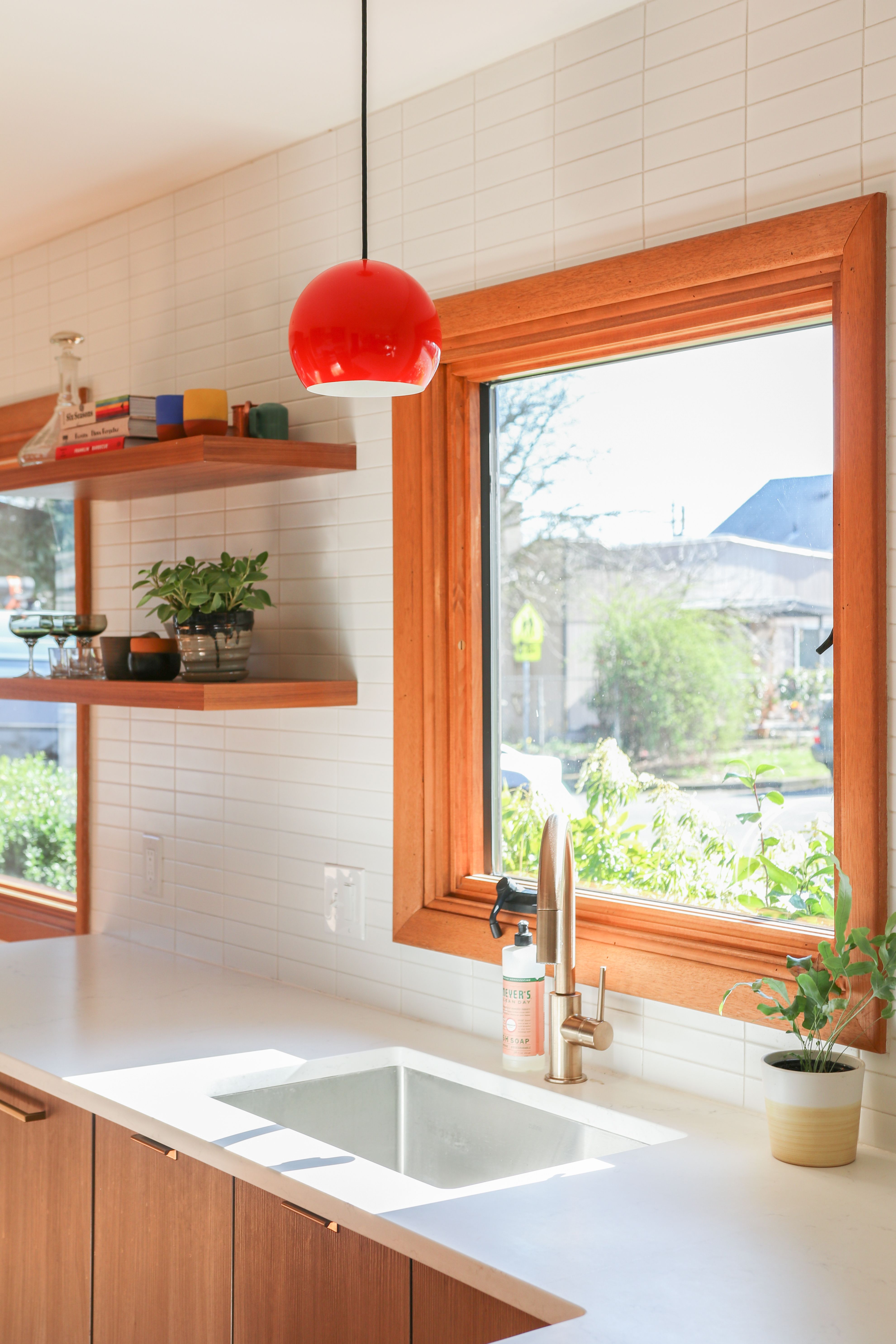 wood paneled dining room with persimmon accents 