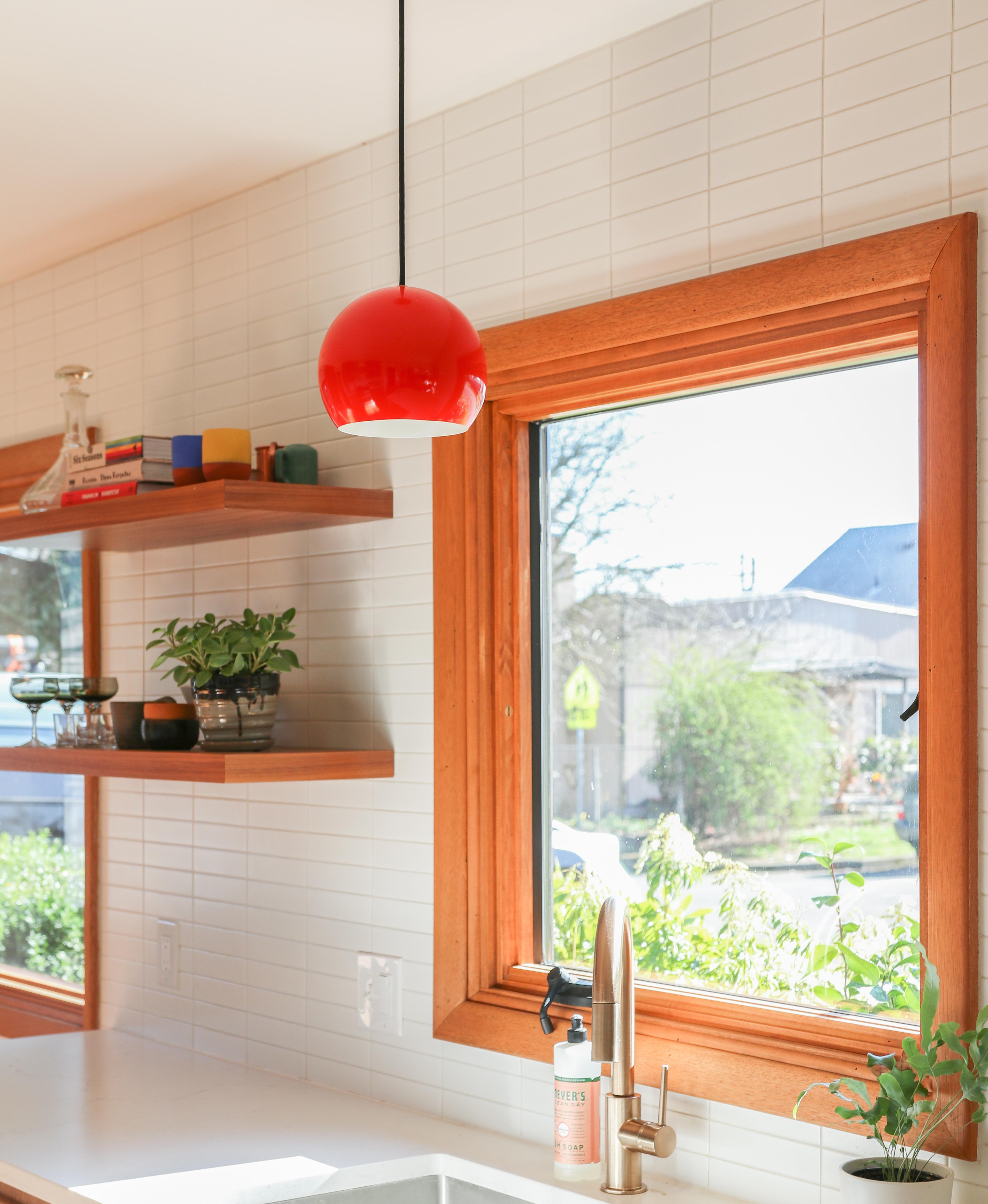 wood paneled dining room with persimmon accents