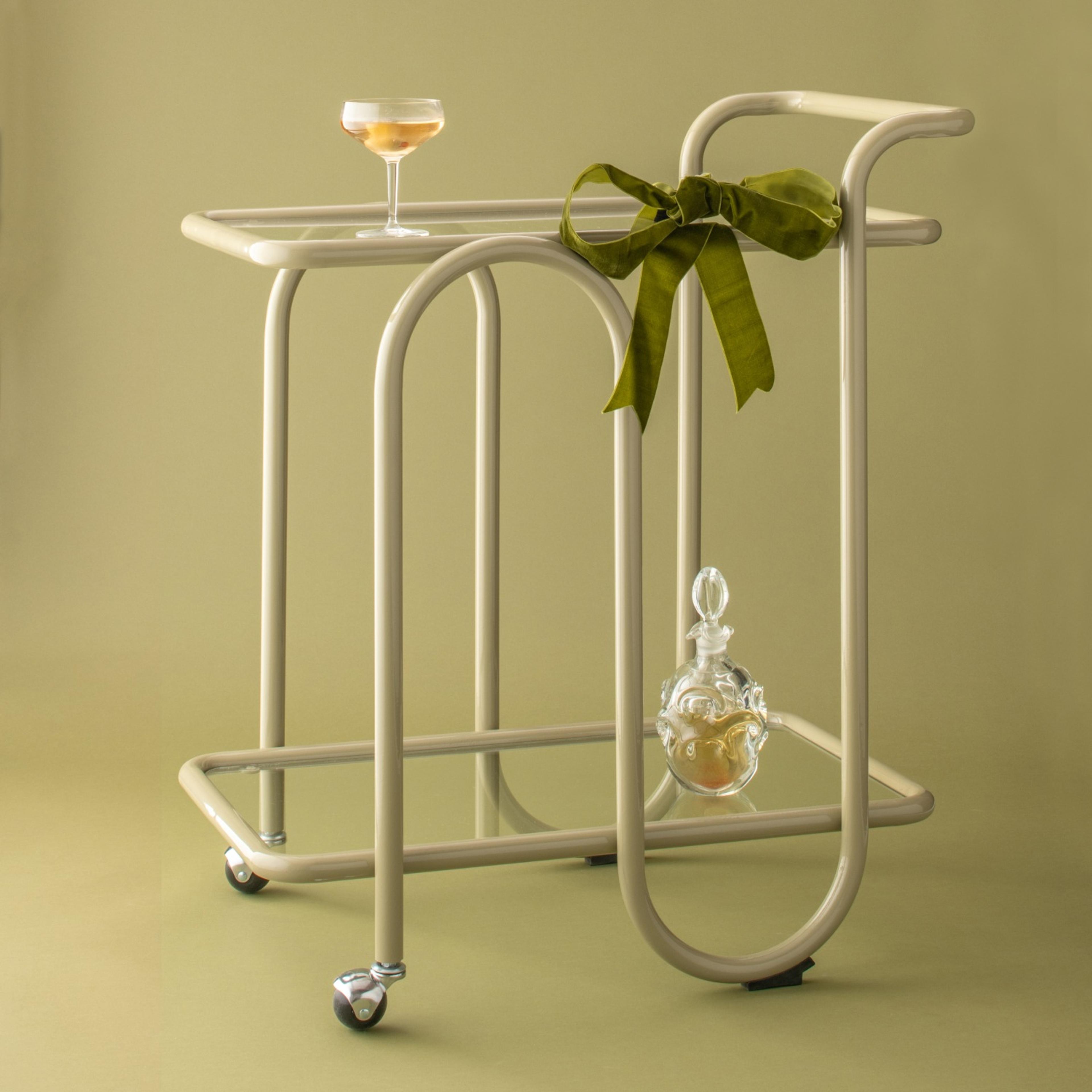 Schoolhouse lolly bar cart topped with a green bow