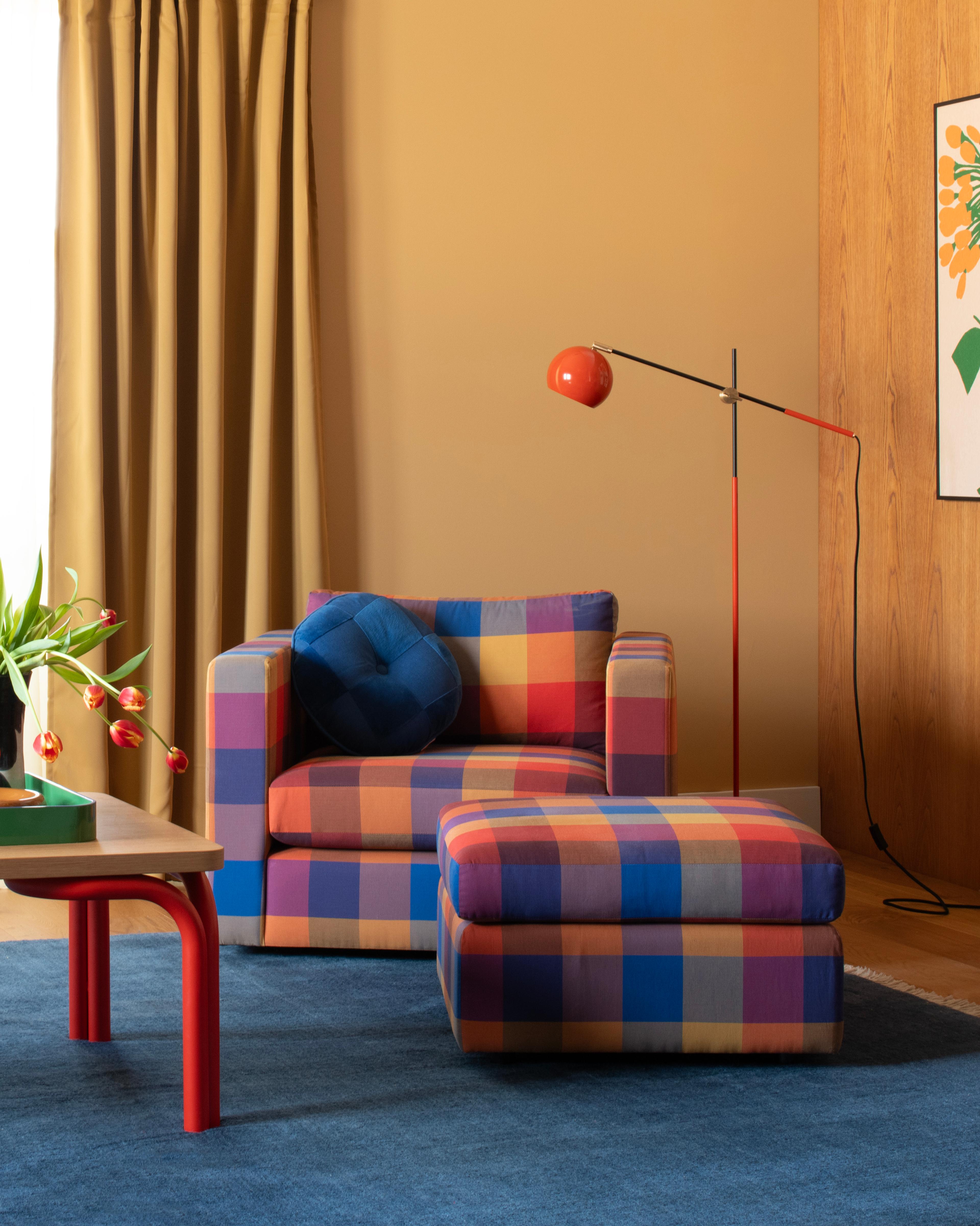 Plaid chair in corner 