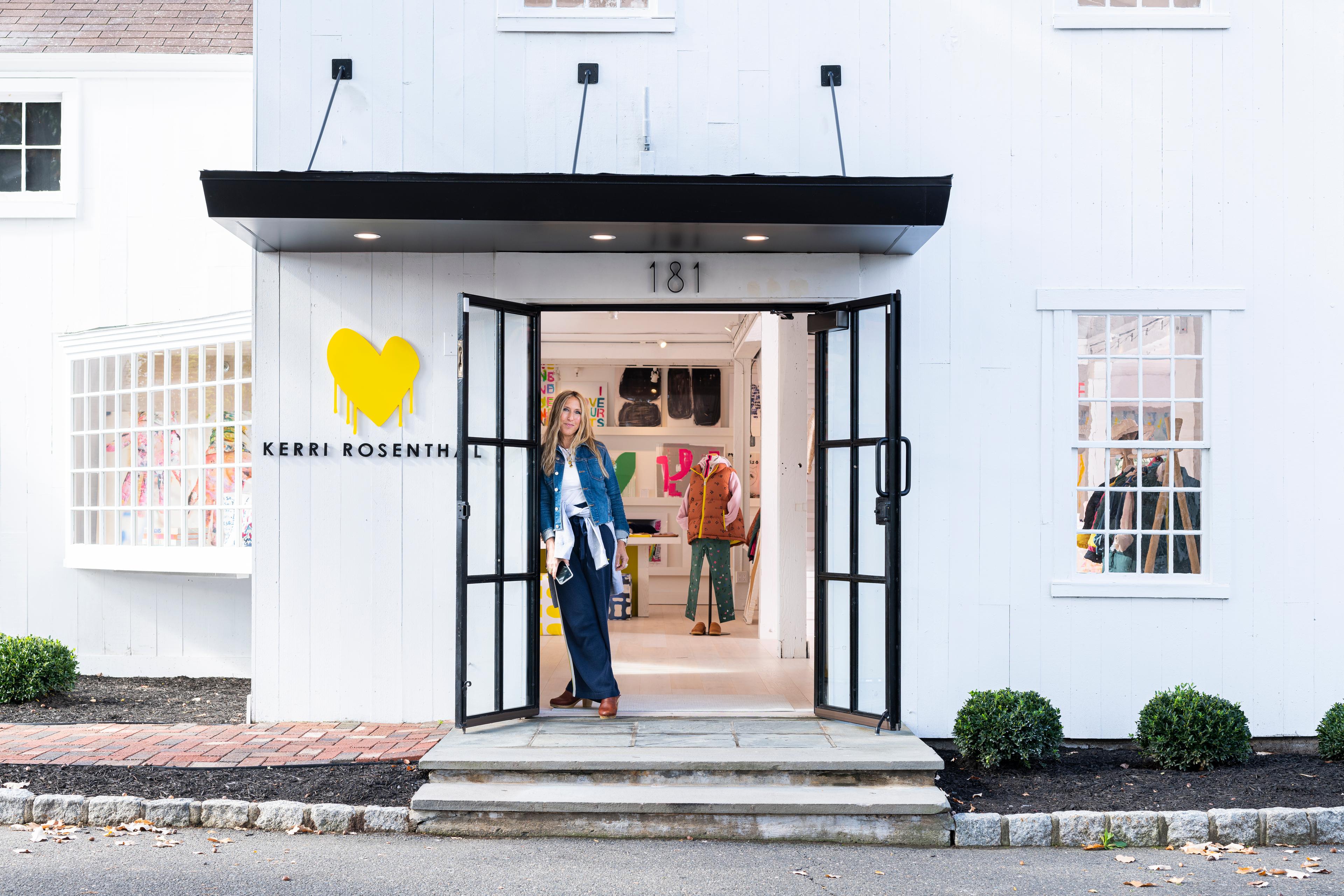 Woman standing in front of her store.