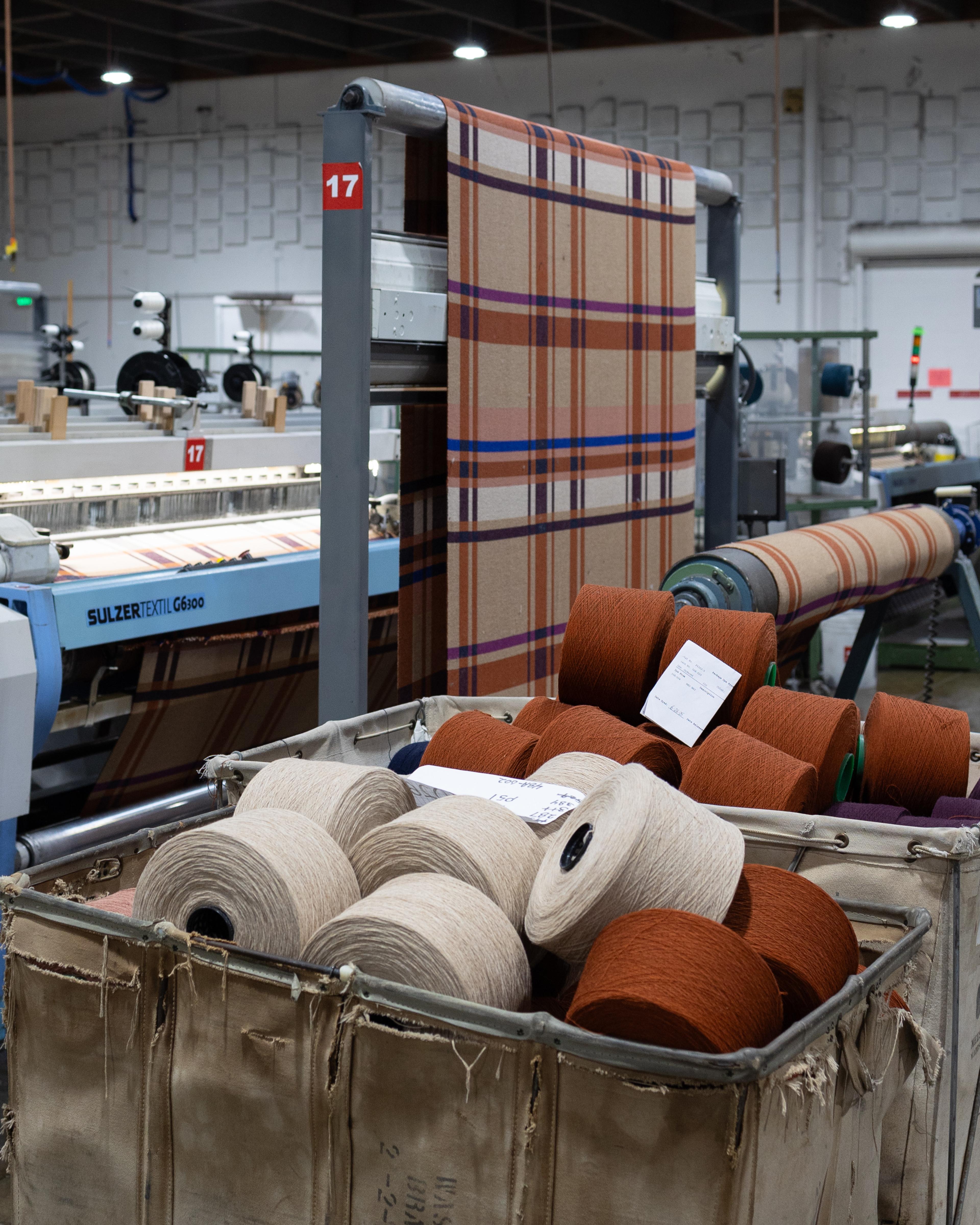 BTS of plaid blanket being made.