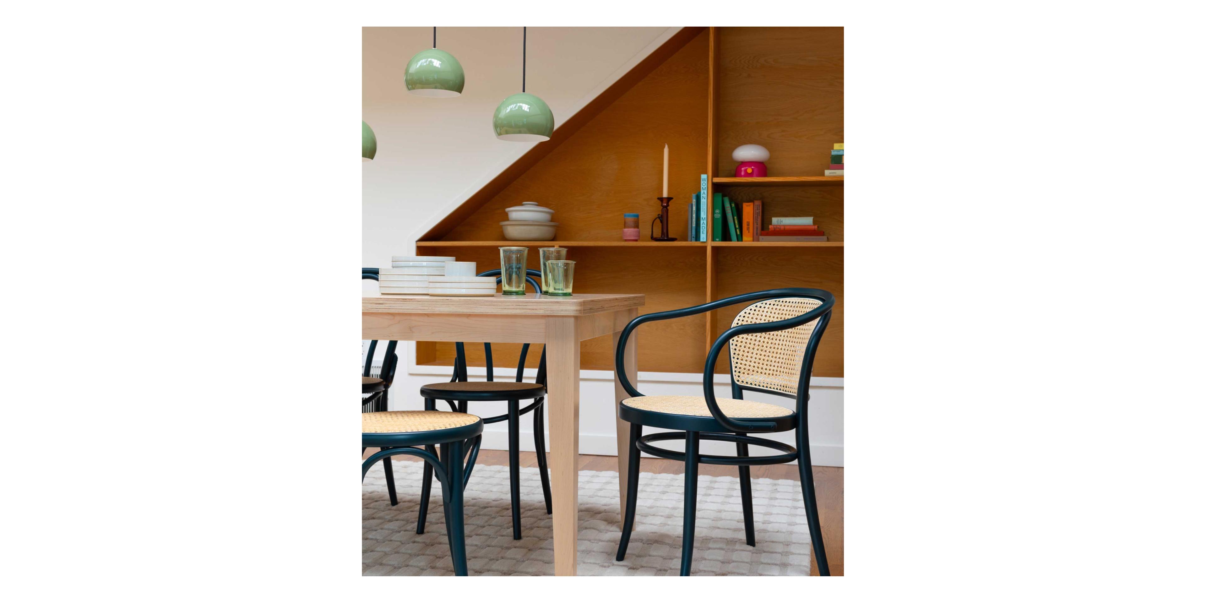 dining room with darn caned chair