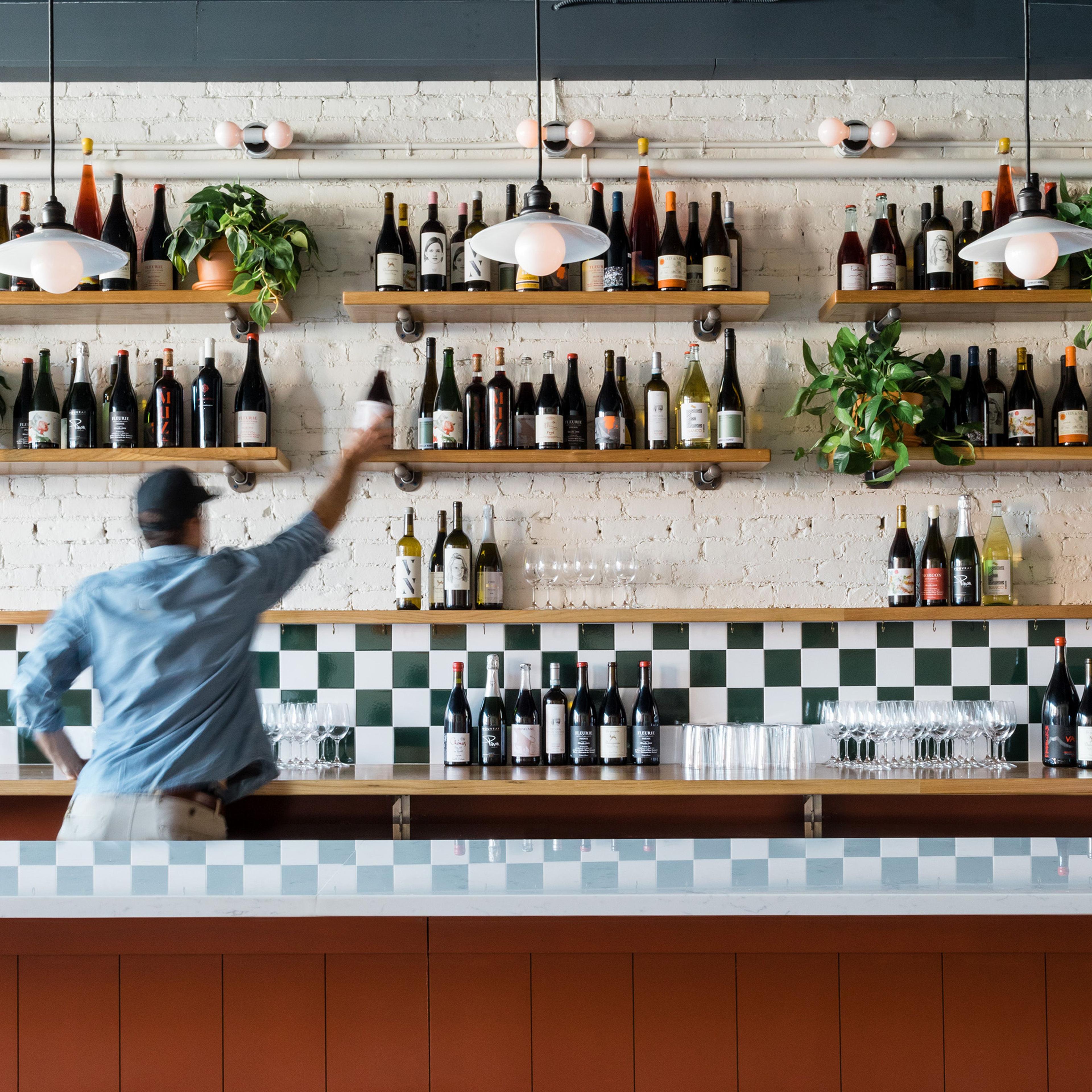 Grays Hall resturant in Boson, Red bar with checkered black splash and three pendants