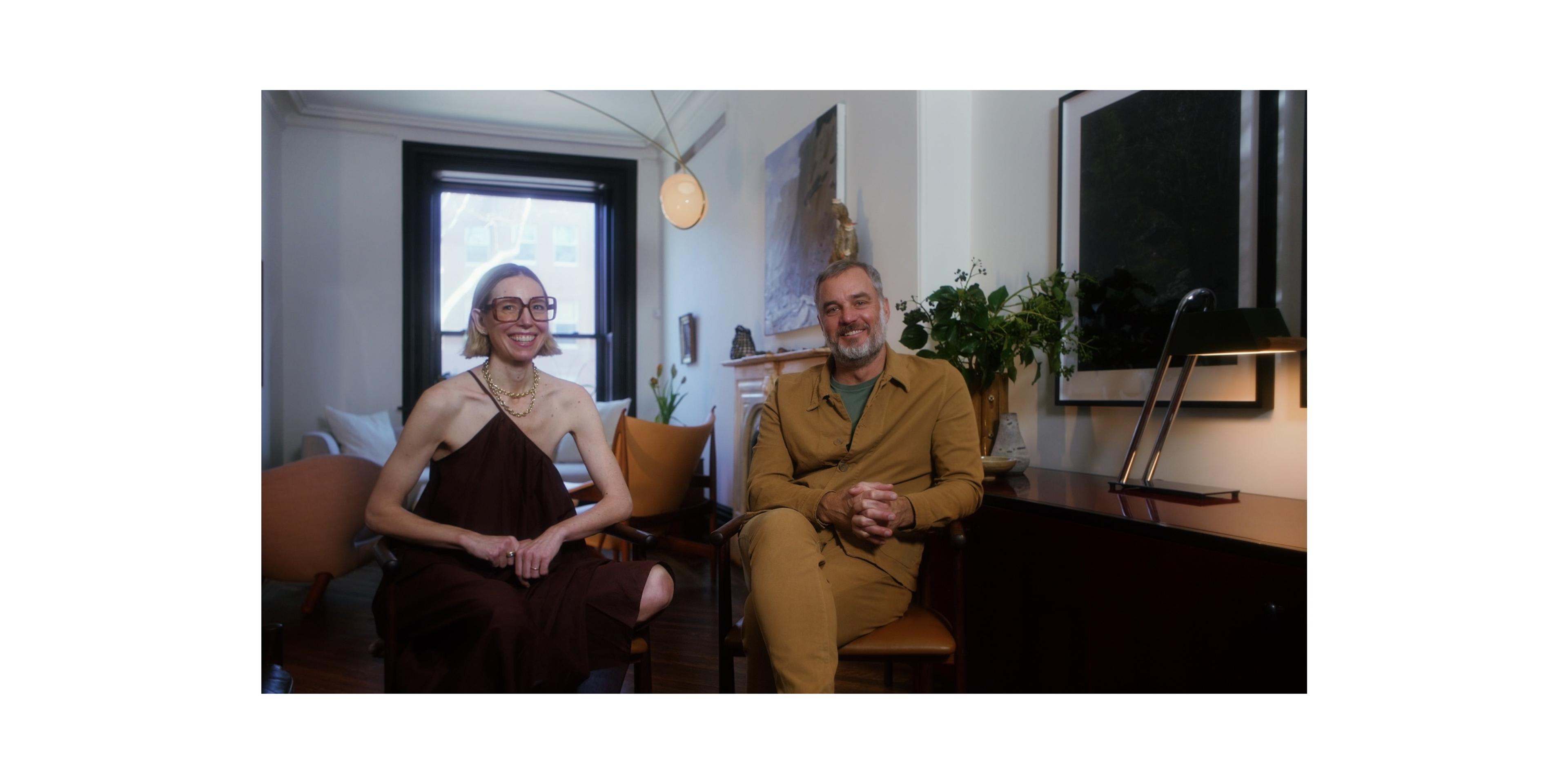 Frame of Erin & Jason smiling next to black and chrome table lamp
