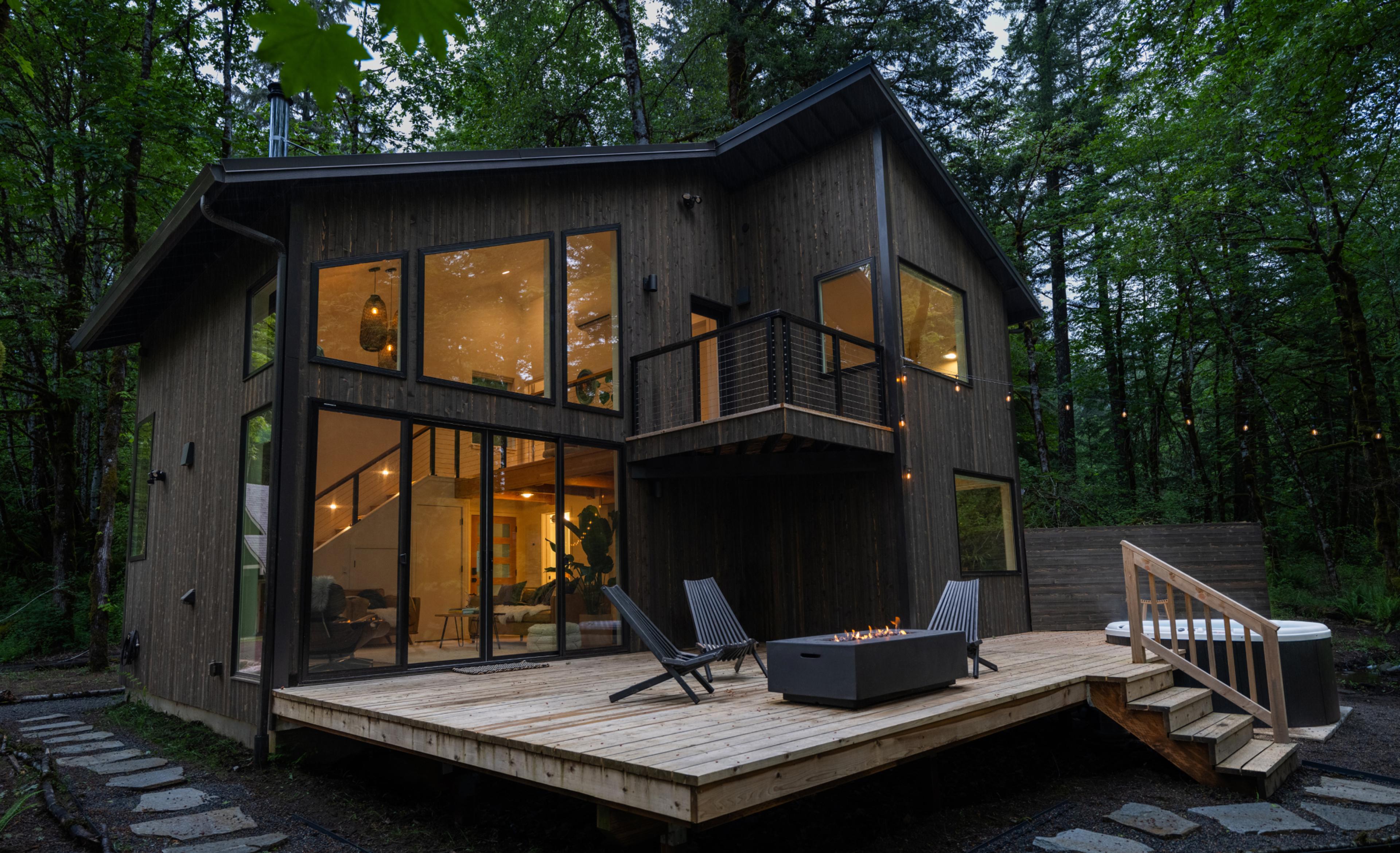 Dark wooded cabin nestled in Oregon woods