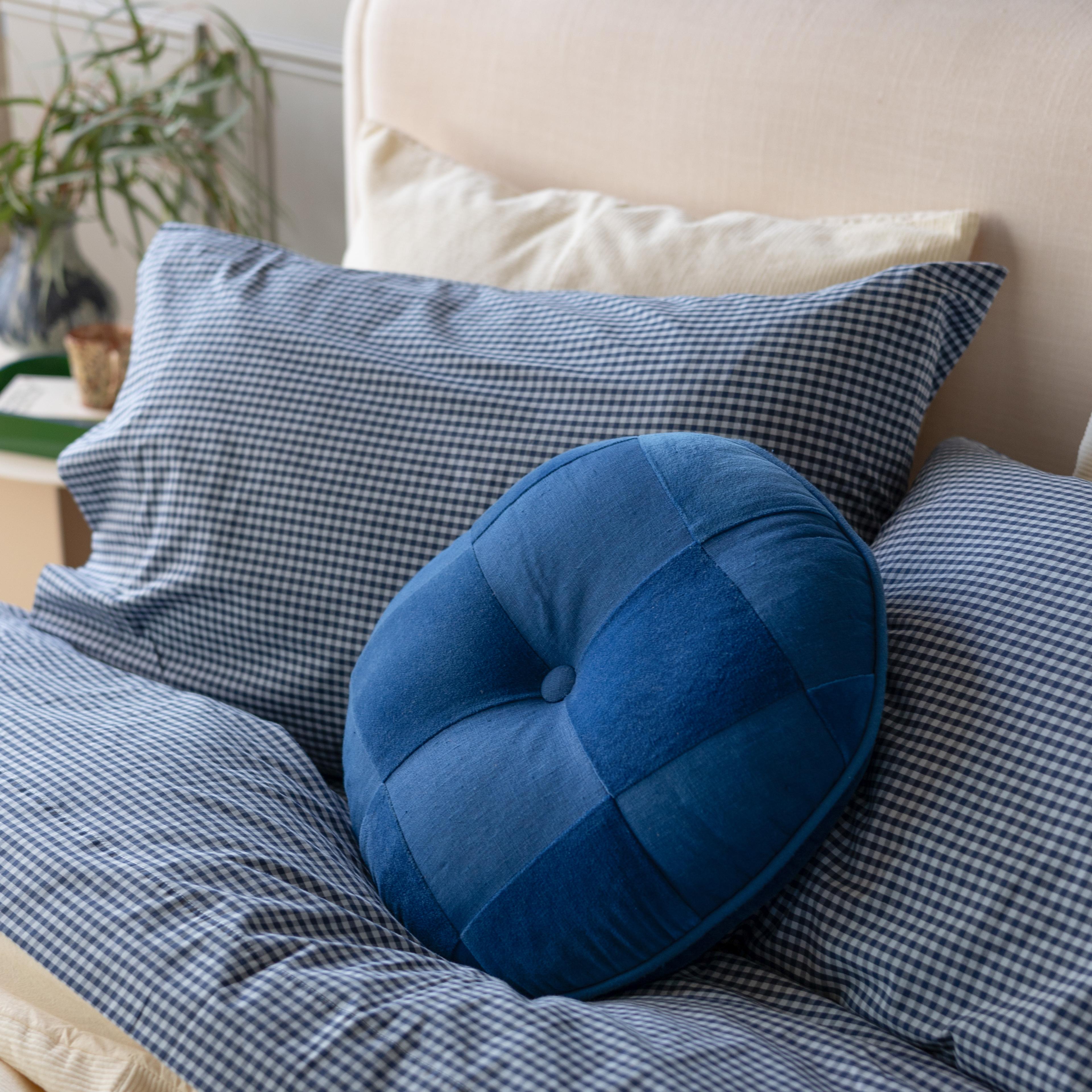 Gingham sheets on bed.