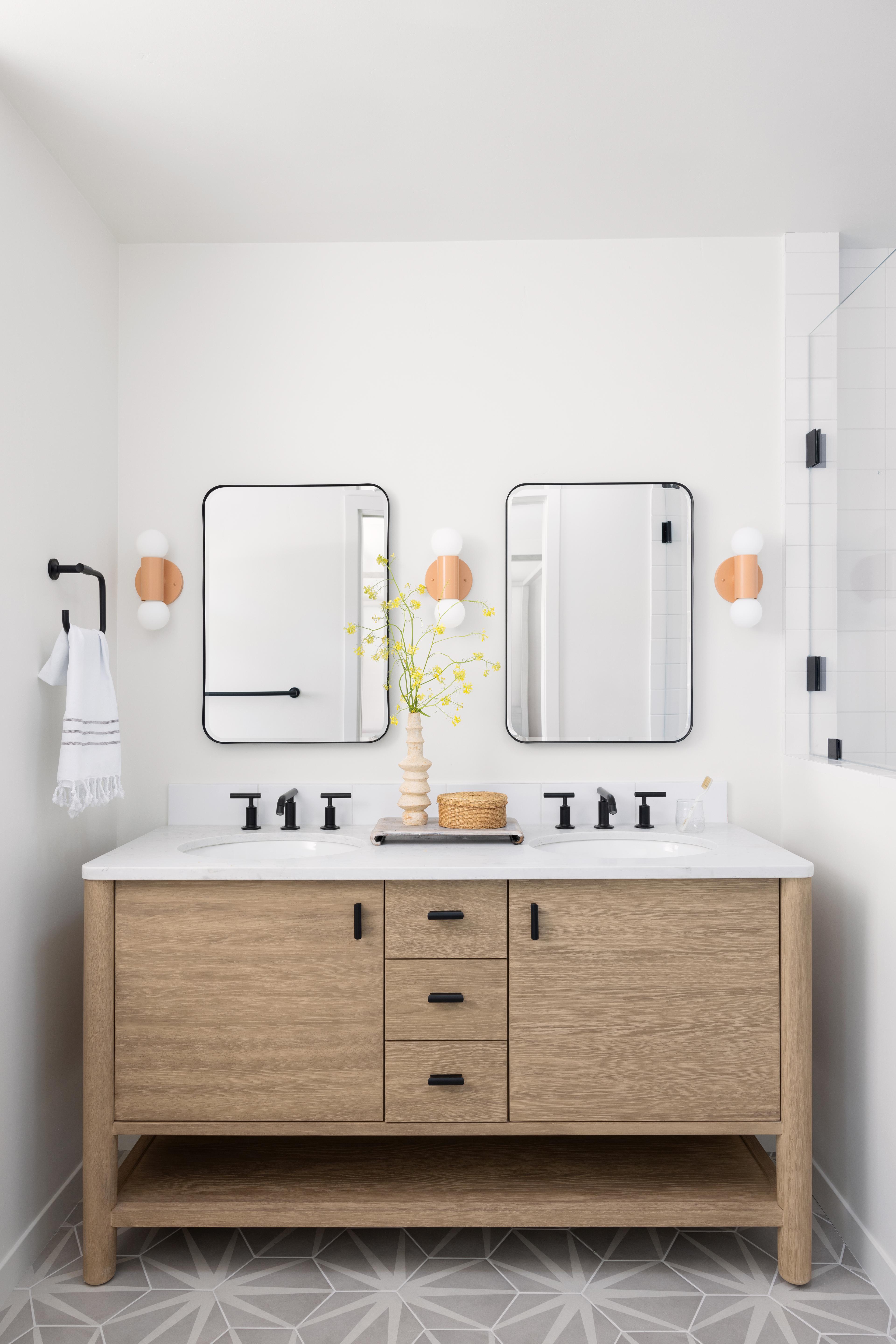 Pink sconces in modern bathroom.