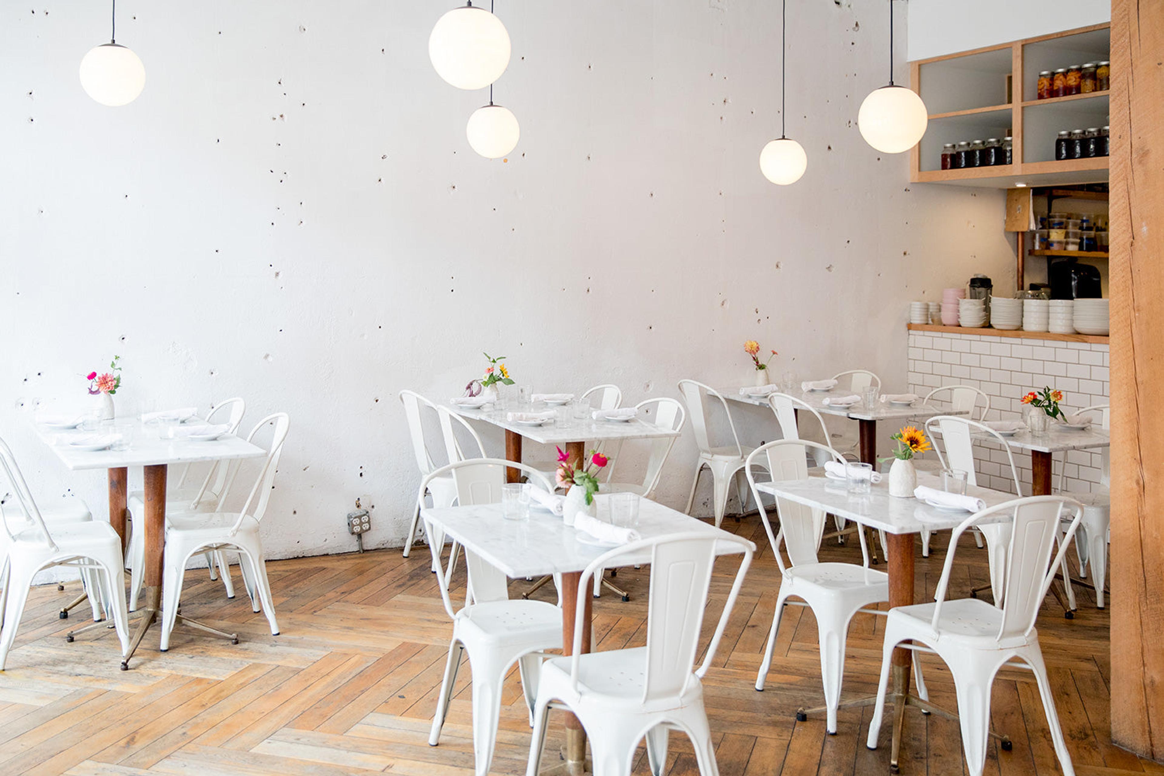 coffee shop with white chairs 