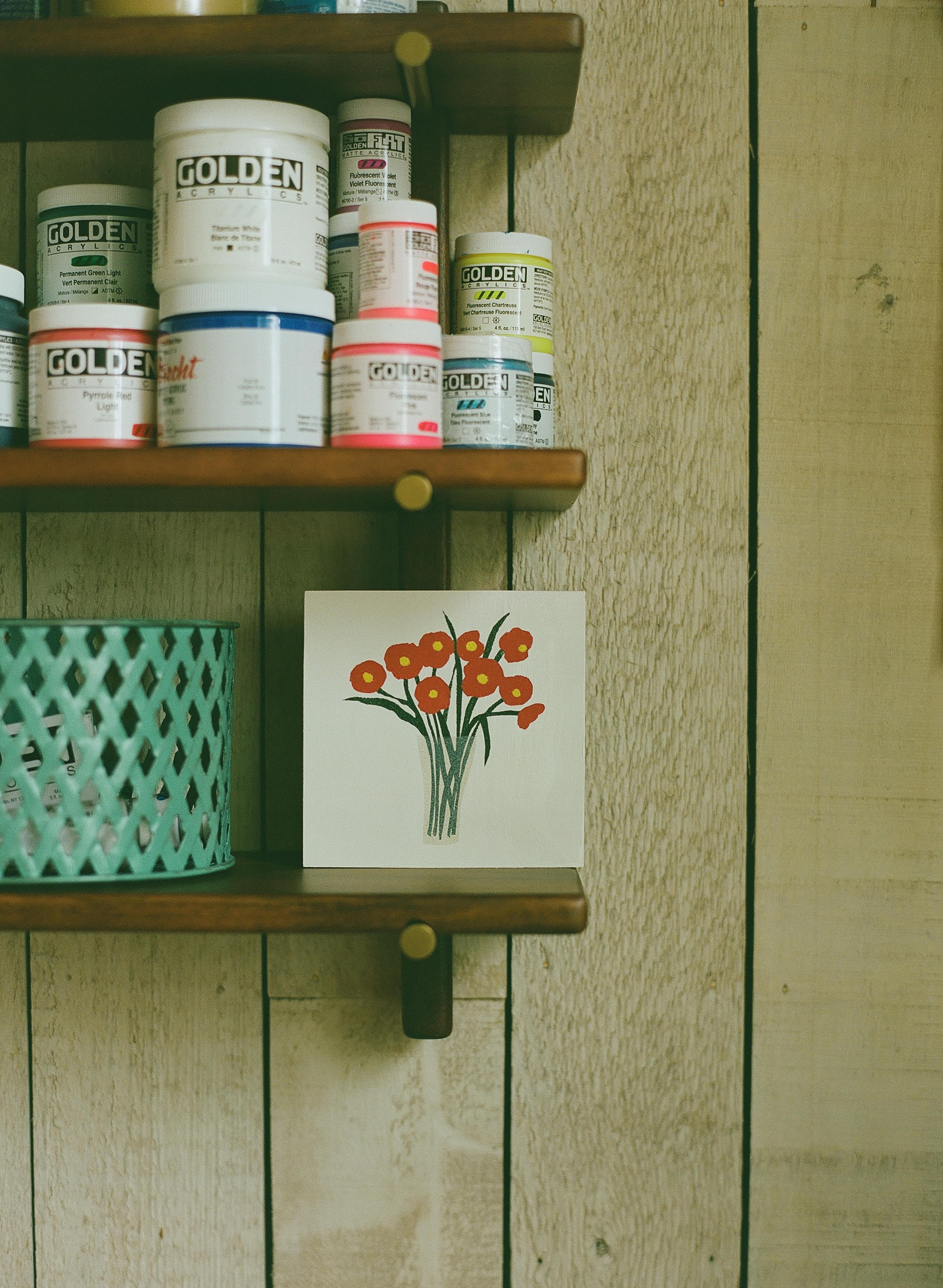 Artist painting on canvas in art studio