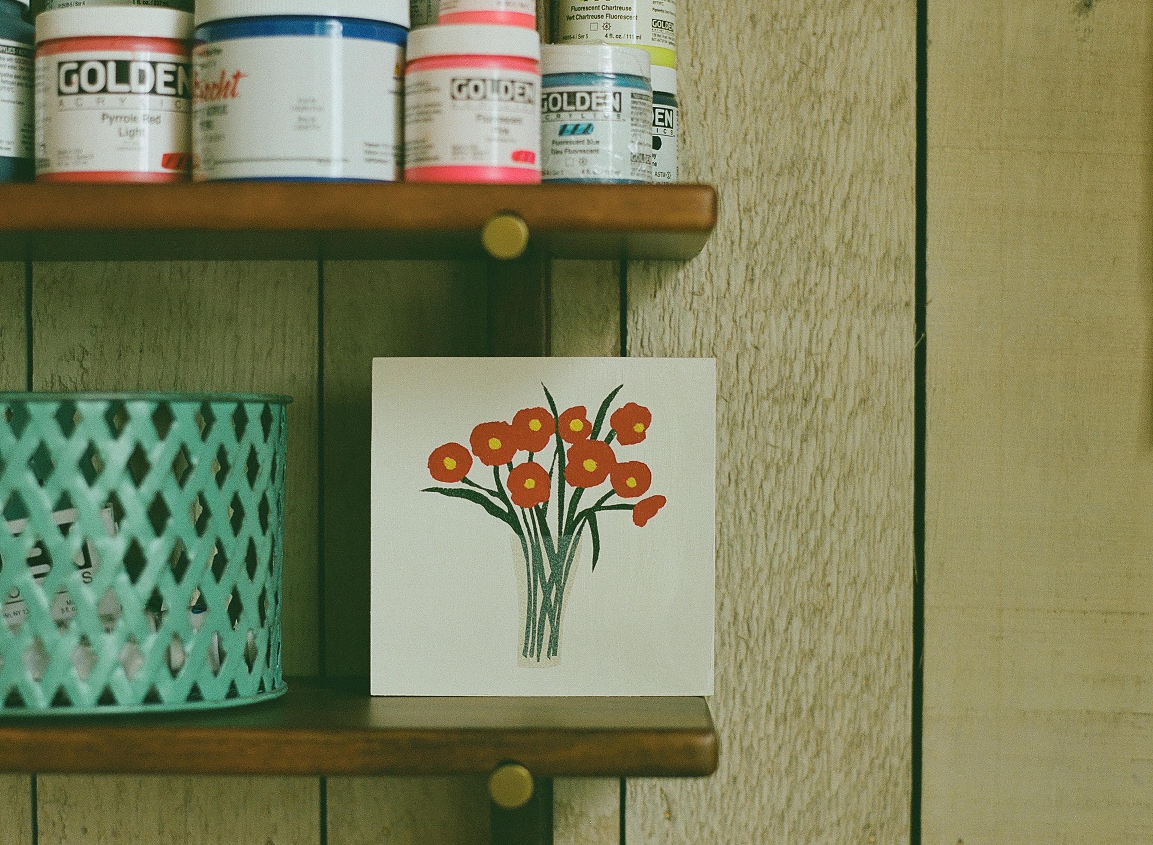 Artist painting on canvas in art studio