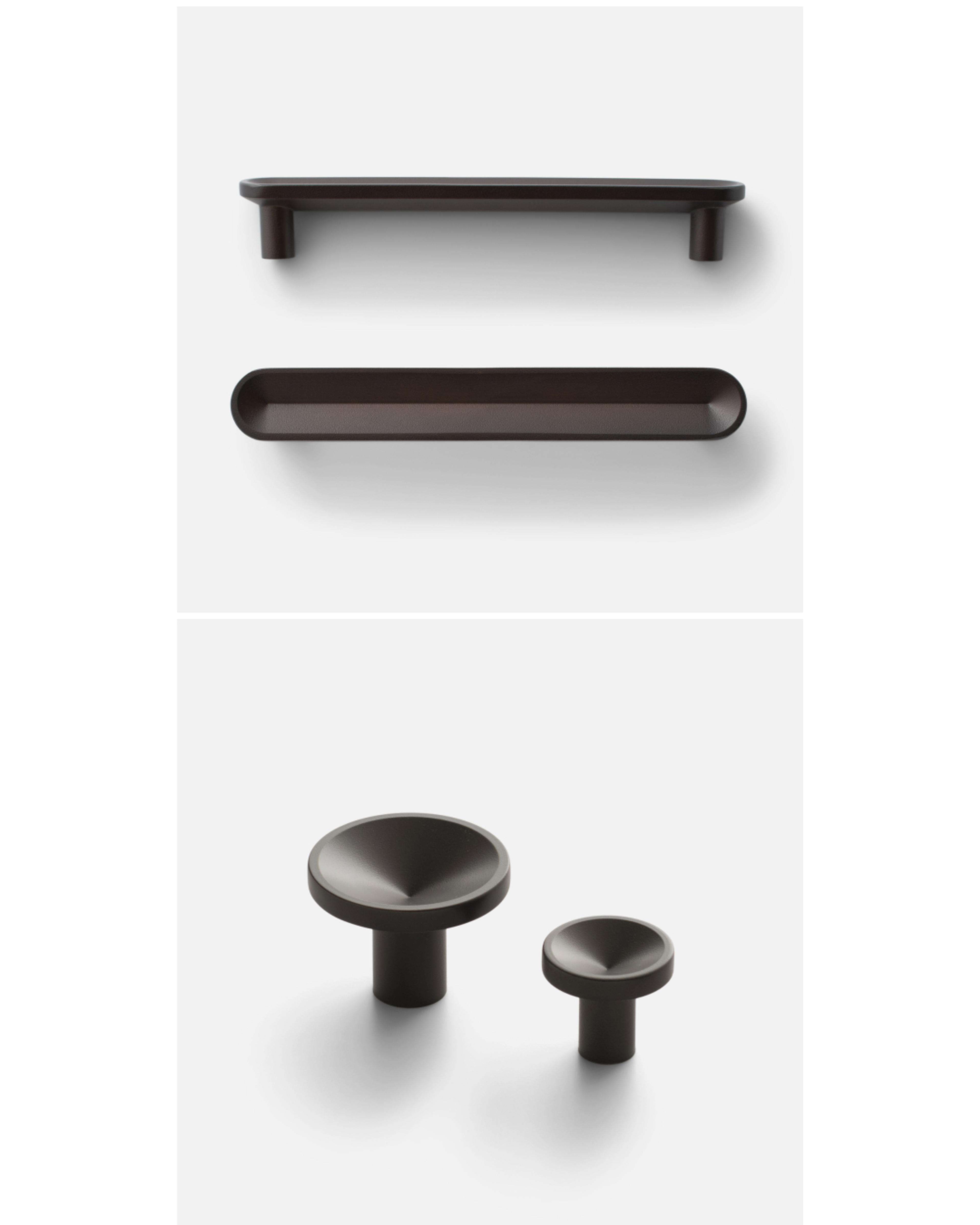 Black pulls and knobs on white background