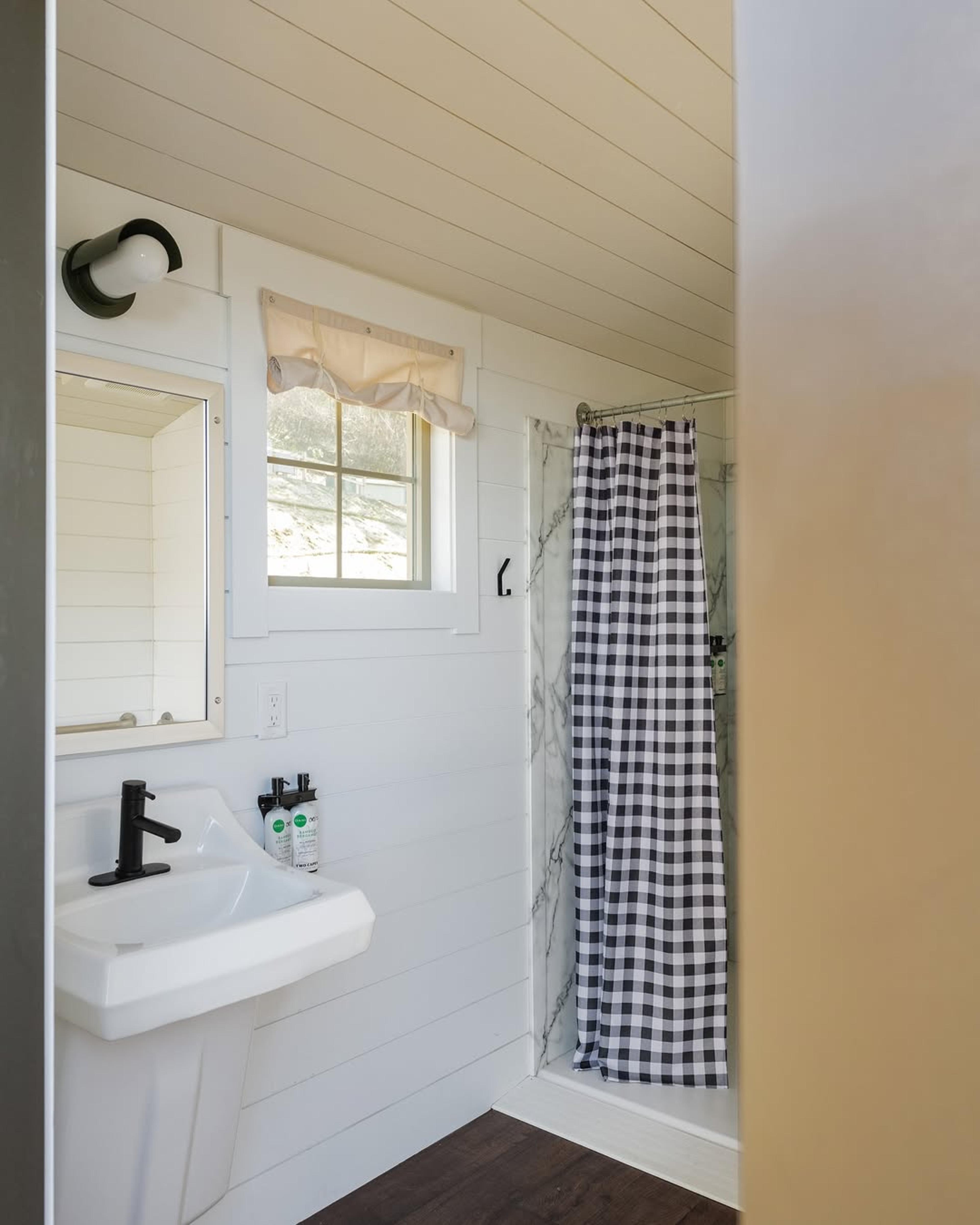 Shiplapped bathroom with modern cabin vibes. 