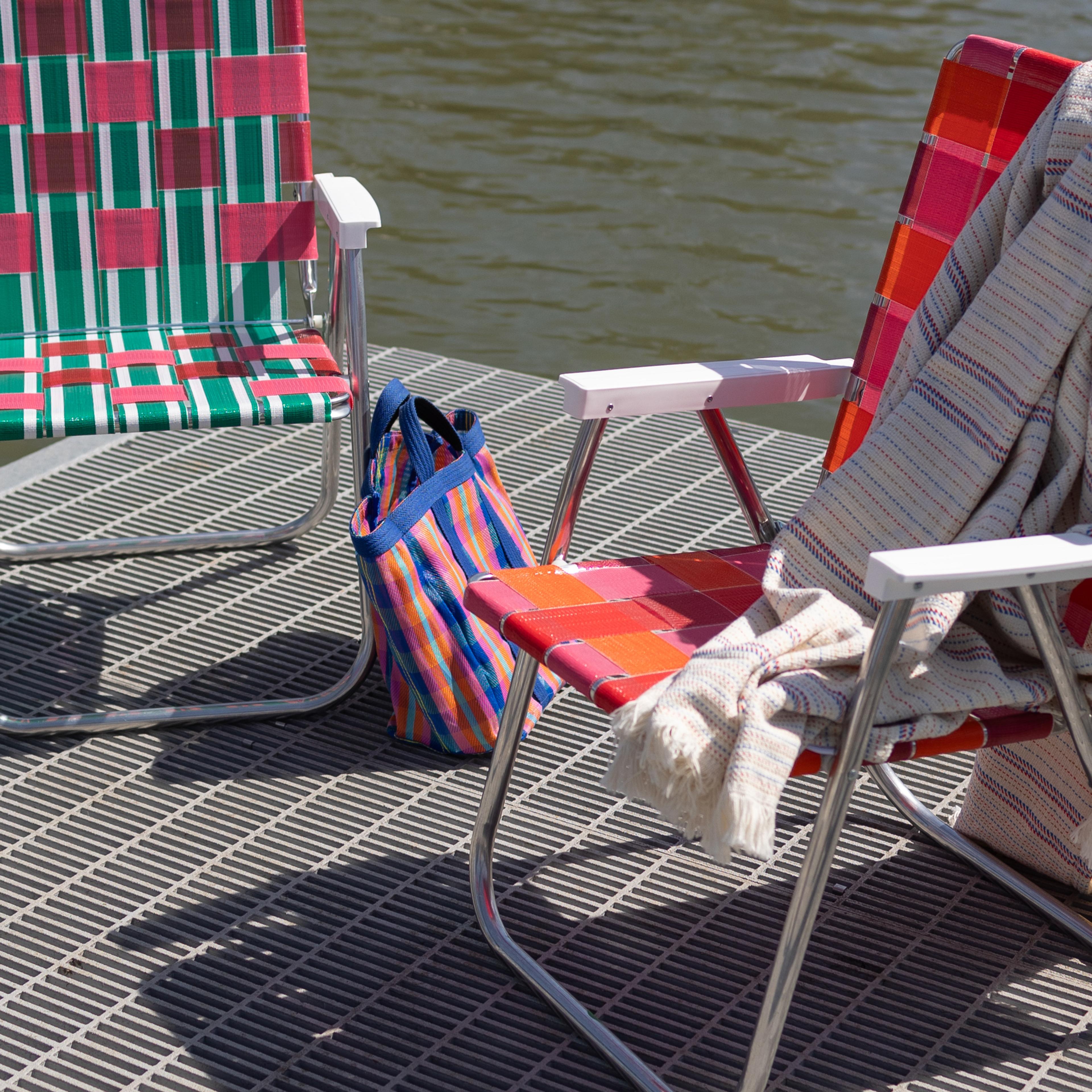 Folding chairs on a dock.