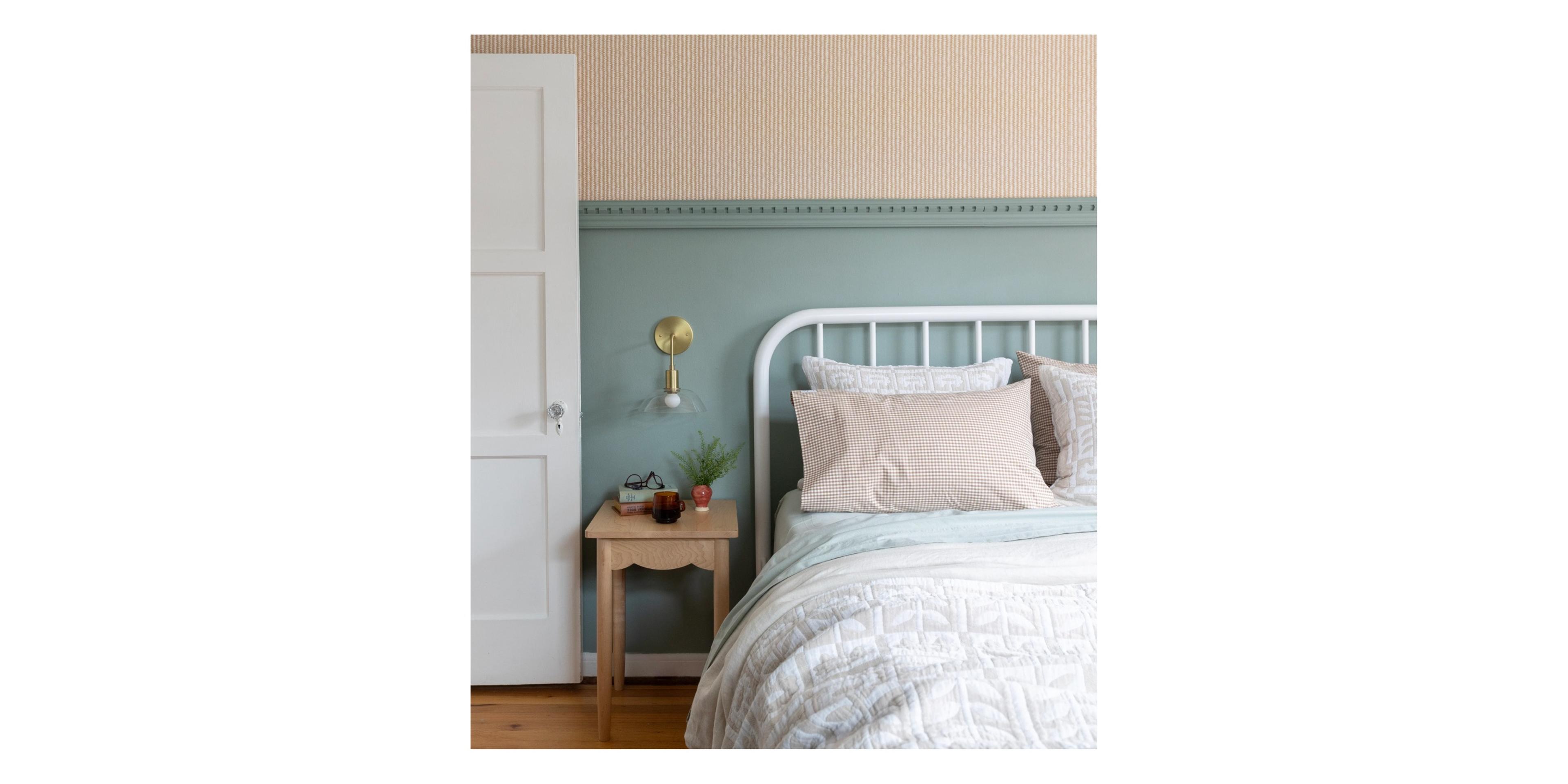 Blue bedroom with white bed and gingham bedding.