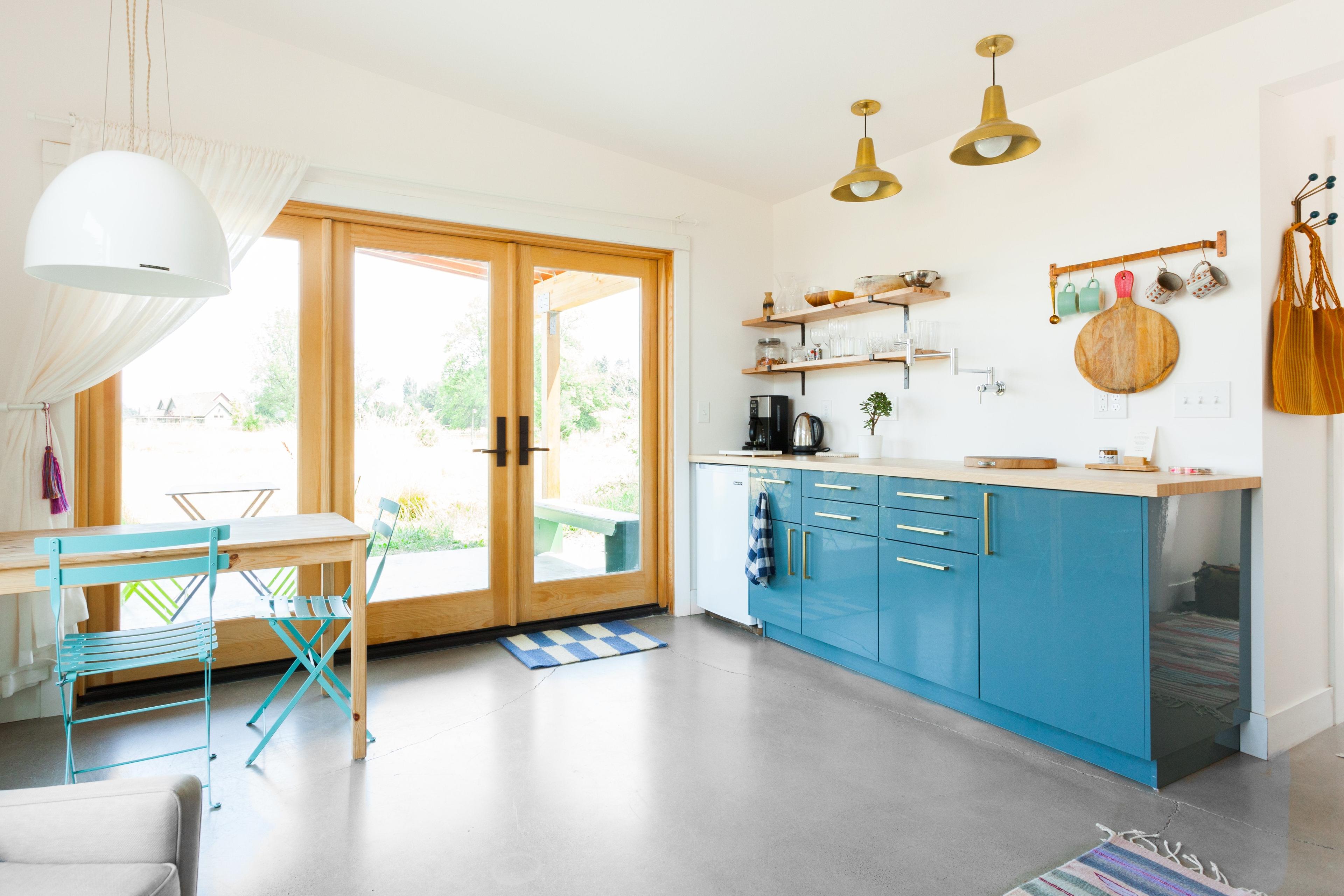 kitchen with blue cabinets and large doors