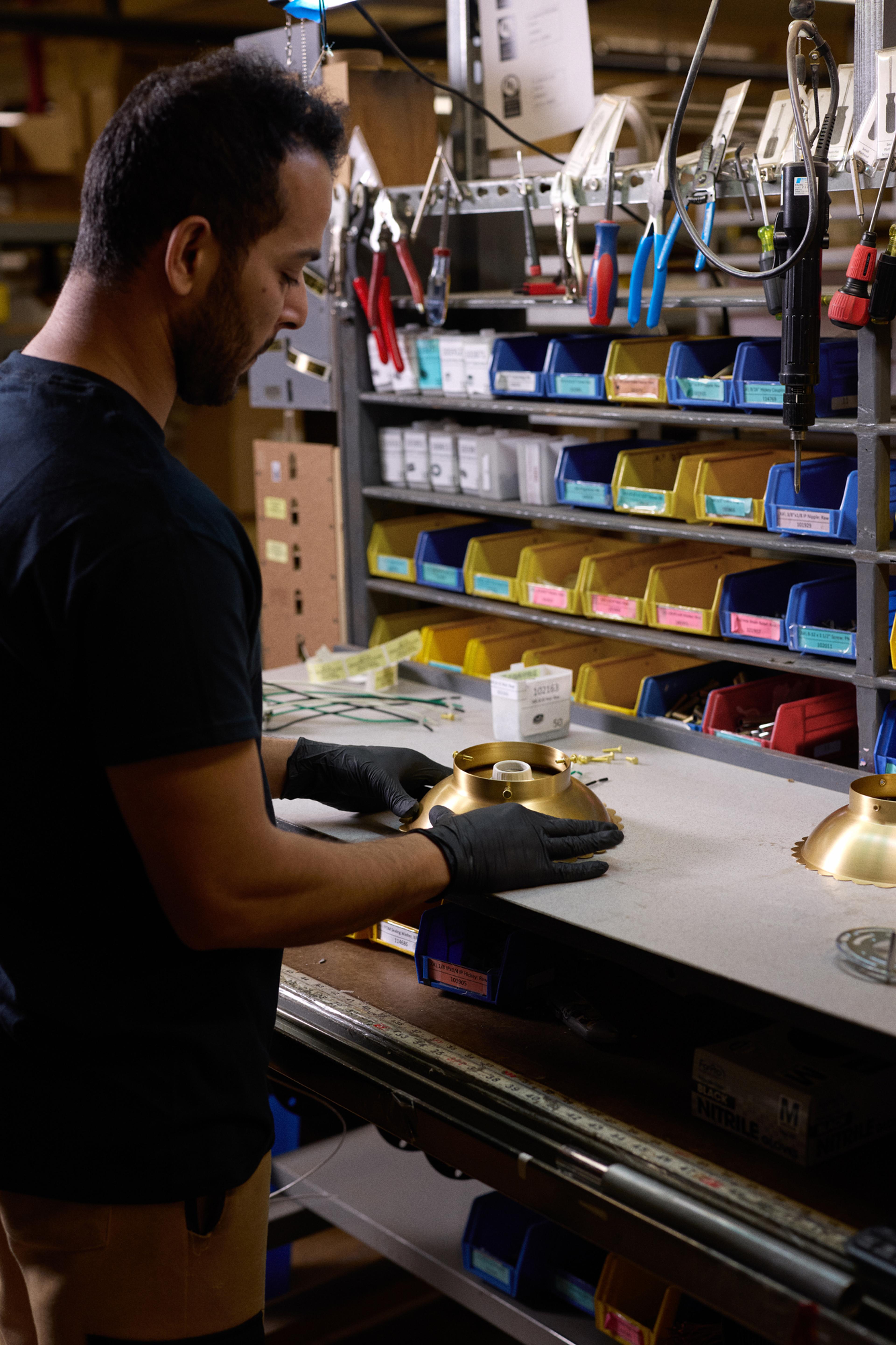 person assembling light fixture